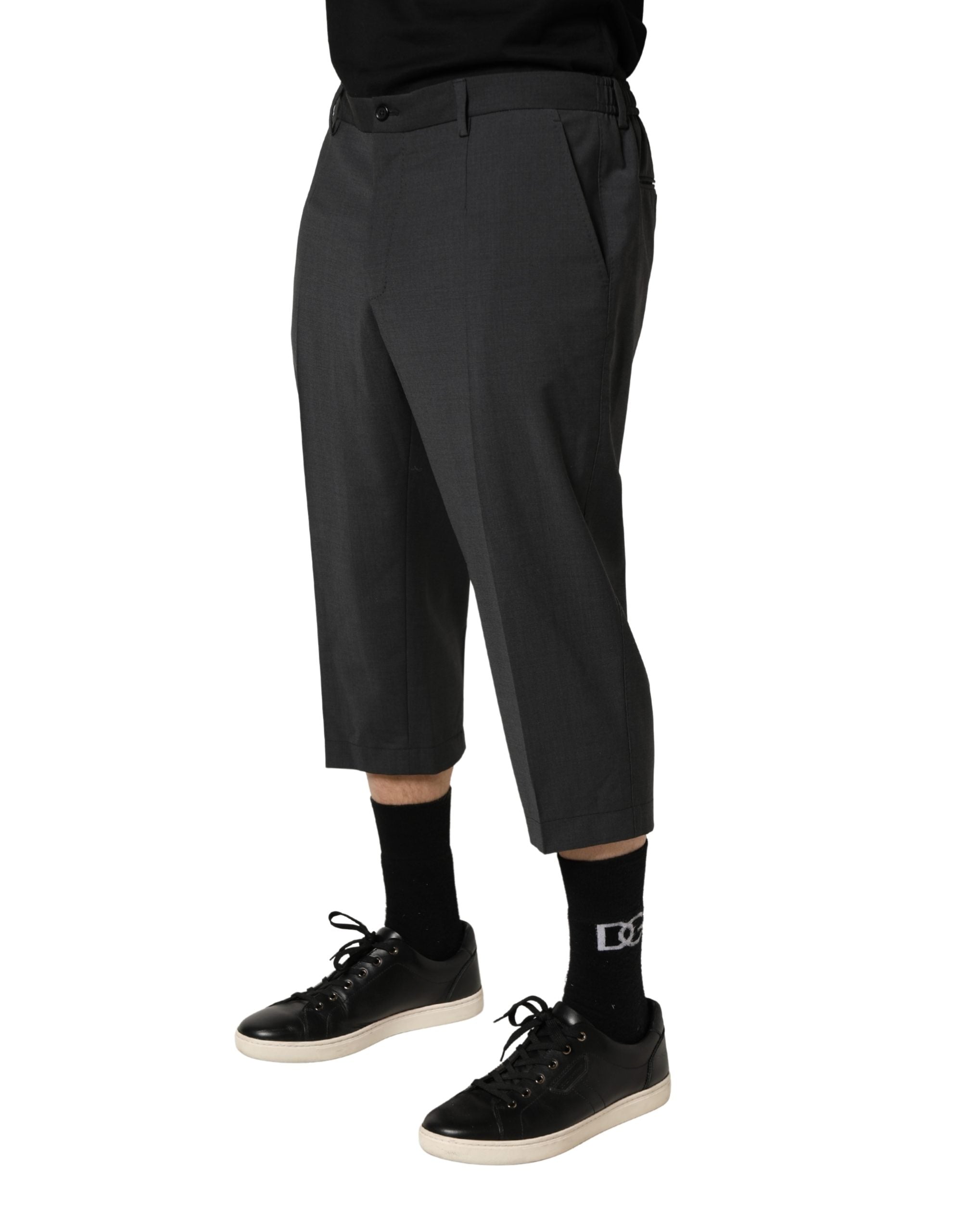 Elevate your wardrobe with Dolce & Gabbana's Dark Gray Wool Cropped Chino Trouser Pants, a masterpiece of Italian craftsmanship that embodies timeless elegance and versatility.