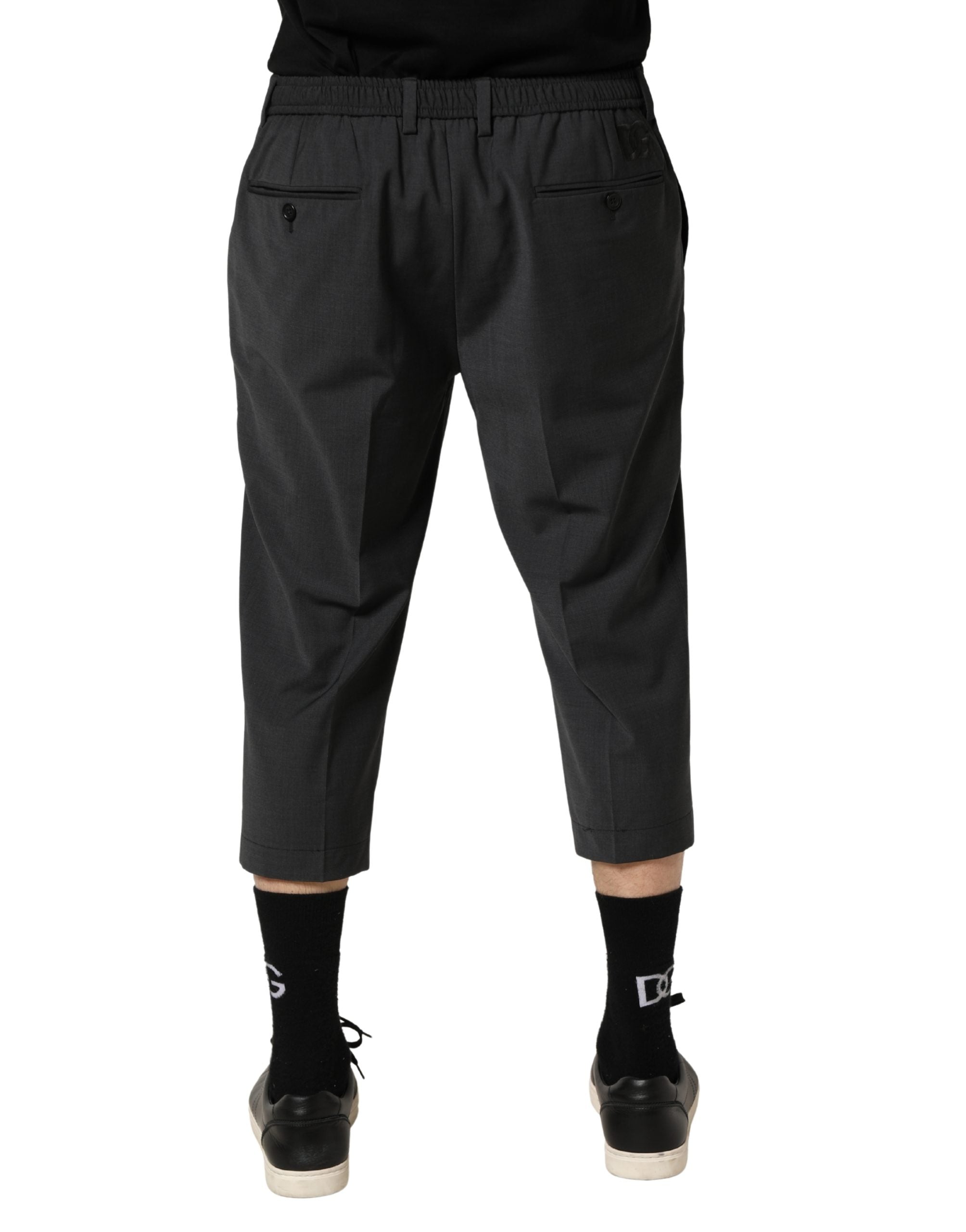 Elevate your wardrobe with Dolce & Gabbana's Dark Gray Wool Cropped Chino Trouser Pants, a masterpiece of Italian craftsmanship that embodies timeless elegance and versatility.