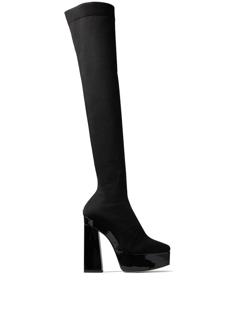 Indulge in the exquisite craftsmanship of Jimmy Choo's Black Fabric Over The Knee boots, where luxury meets sophistication for unforgettable elegance.