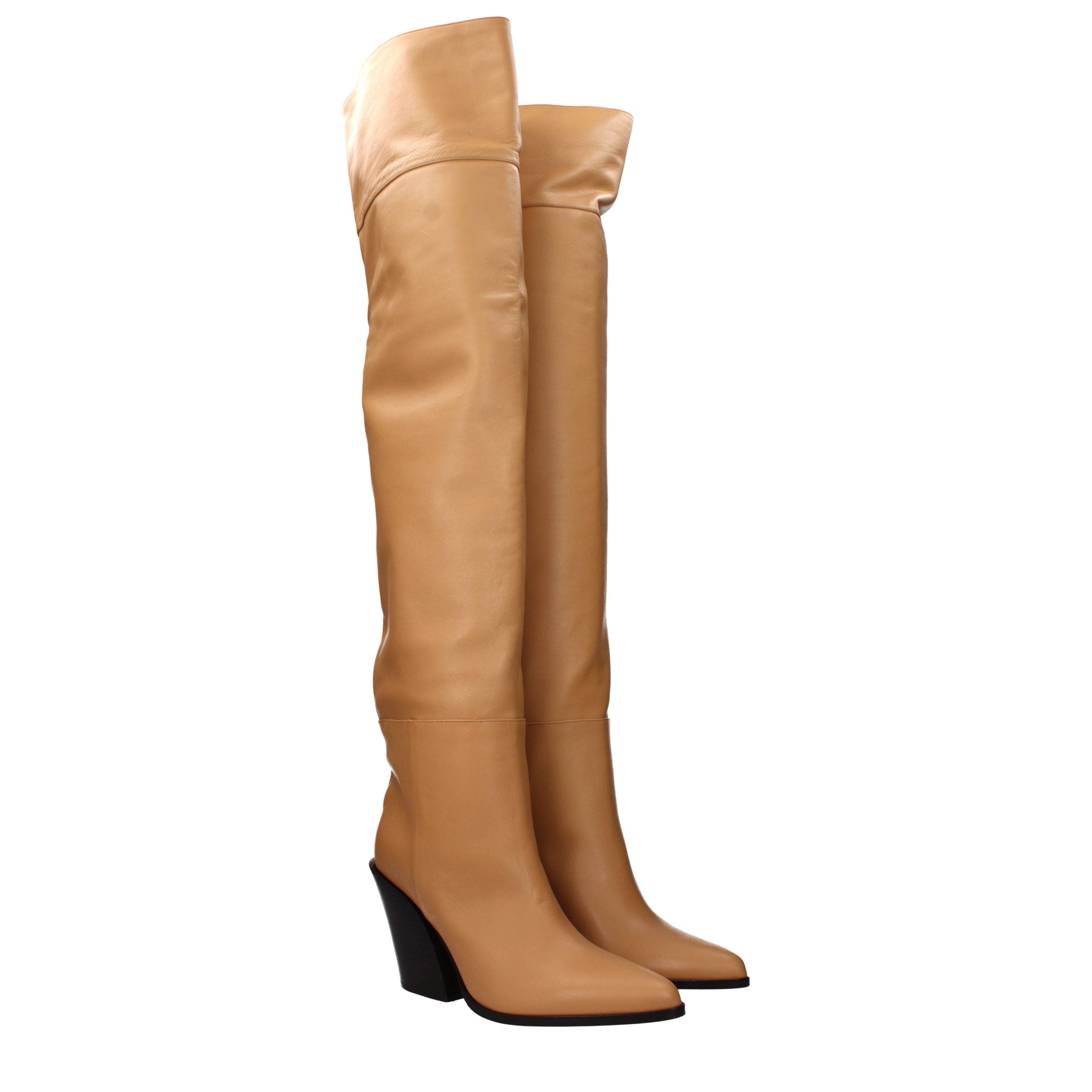 Experience the allure of Jimmy Choo Beige Leather Ankle Boots, where artisanal craftsmanship meets timeless elegance, perfect for the discerning individual.