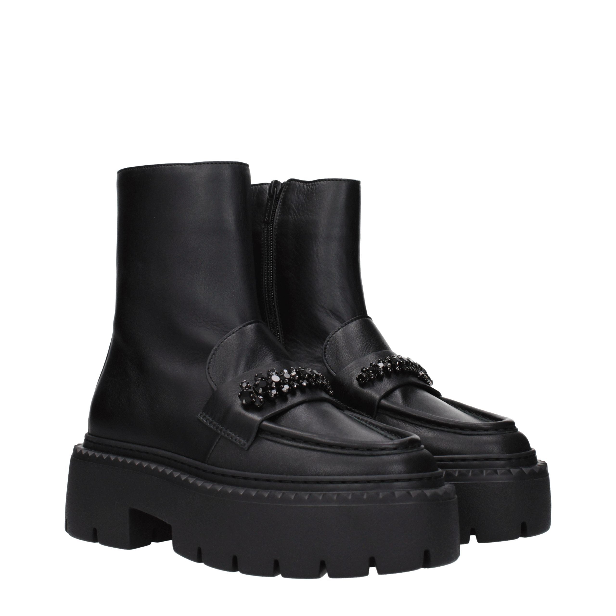 Indulge in the exquisite craftsmanship of Jimmy Choo Black Leather Ankle Boots, where luxurious design meets modern sophistication for the discerning individual.