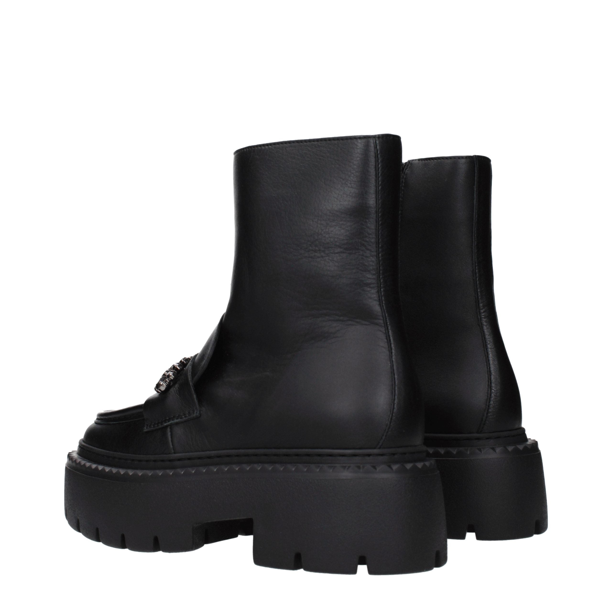 Experience the exquisite craftsmanship of Jimmy Choo Black Leather Ankle Boots, where luxurious design meets modern sophistication for the discerning individual.