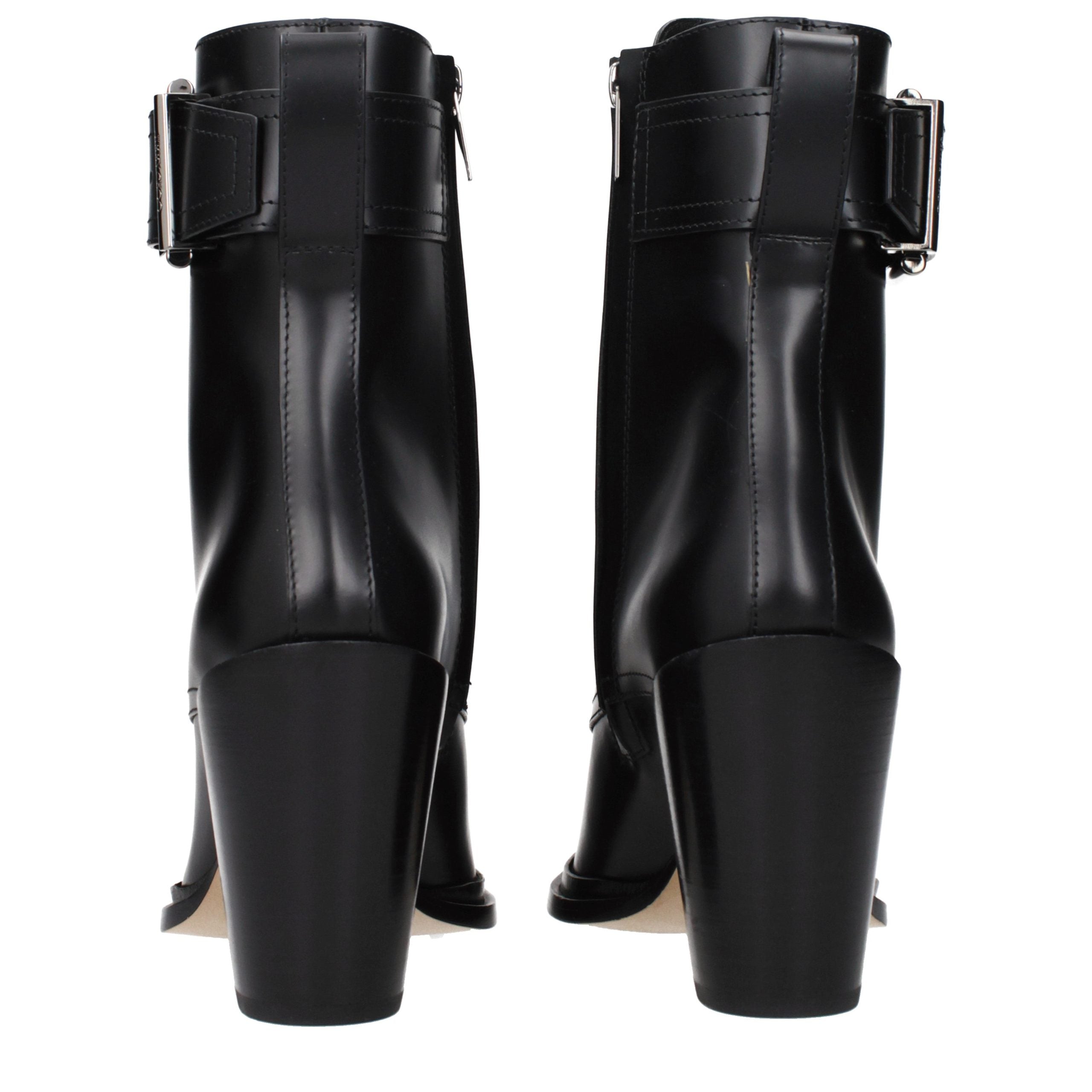 Elevate your style with Jimmy Choo Black Leather Ankle Boots, a timeless blend of opulence and sophistication, perfect for commanding attention in any setting.