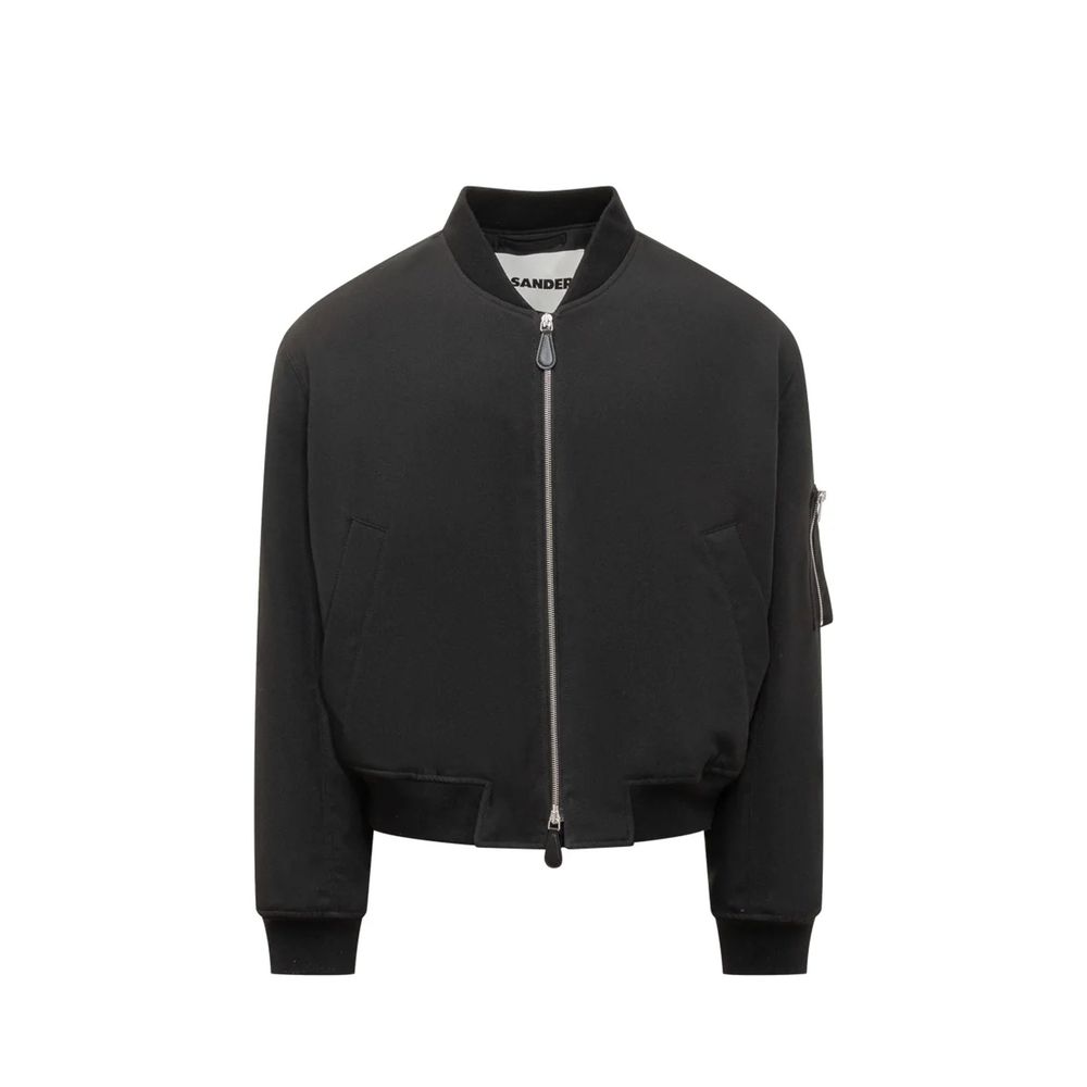 Elevate your style with the Jil Sander Black Polyester Bomber, a masterpiece of Italian craftsmanship that exudes sophistication and modern elegance for the discerning individual.