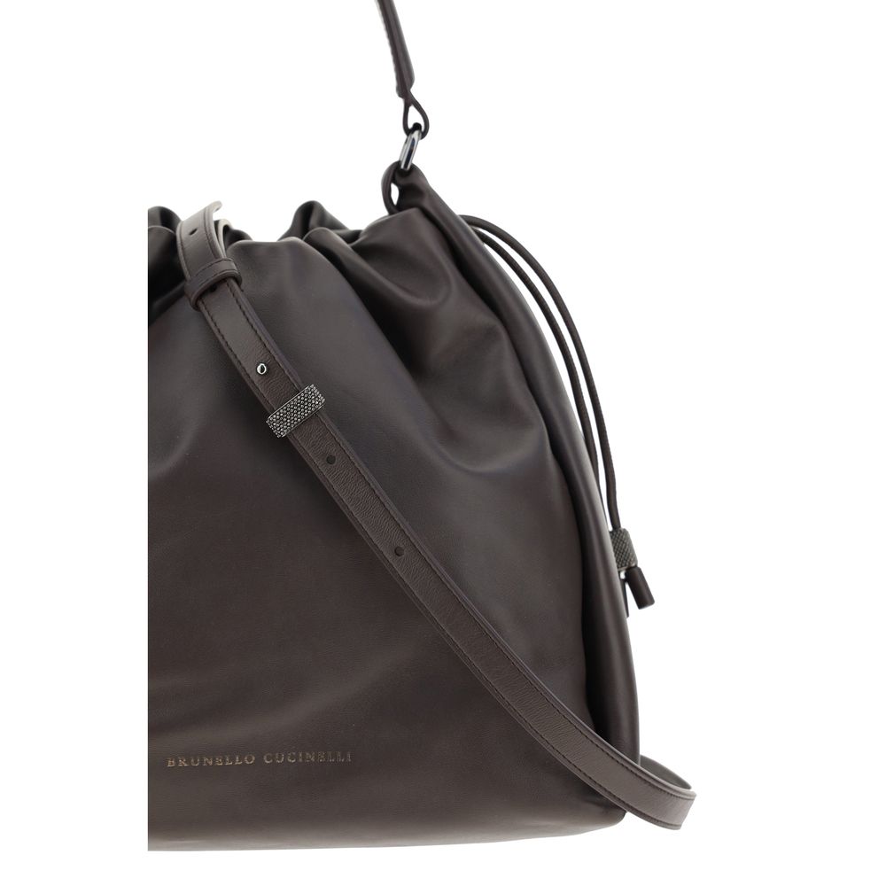 Discover the Brunello Cucinelli Brown Calf Leather Bos Taurus Shoulder Bag, a masterpiece of craftsmanship and elegance, perfect for elevating any sophisticated ensemble.