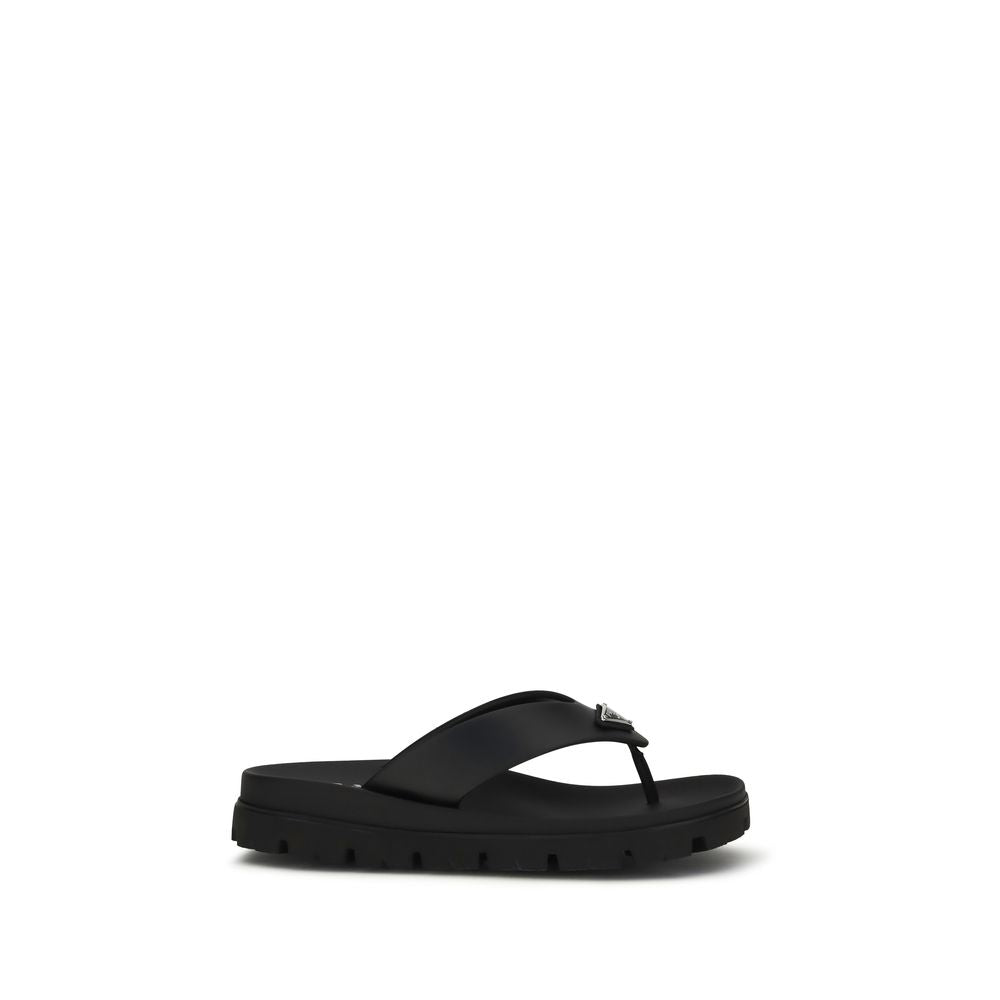 Step into sophistication with Prada's Brown Calf Leather Bos Taurus Flip-Flop Sandals, where luxurious craftsmanship meets effortless elegance for the discerning individual.