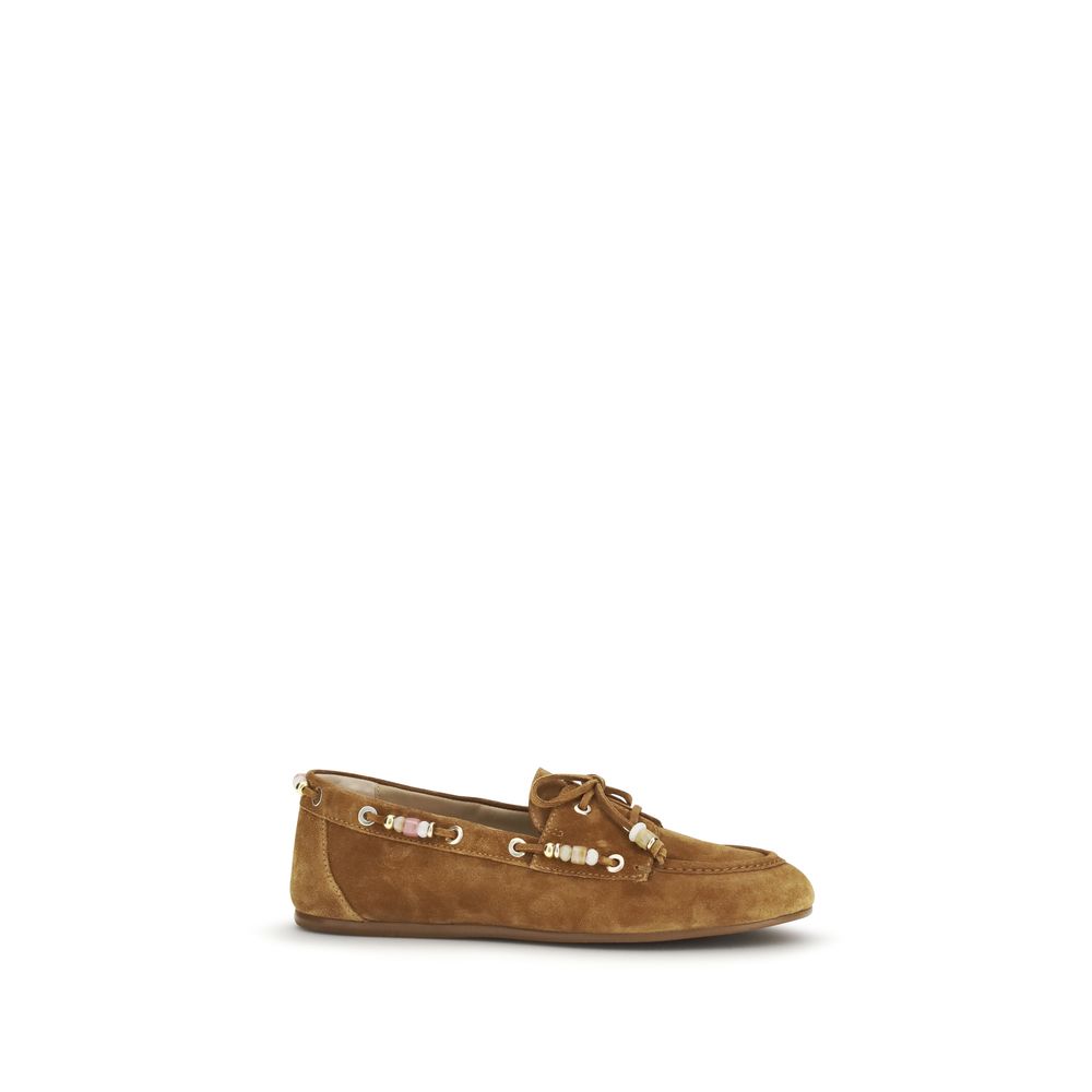 Experience the exquisite craftsmanship of Stuart Weitzman Brown Calf Leather Bos Taurus Slip-On Loafers, where timeless elegance meets luxurious comfort, perfect for the discerning fashion connoisseur.