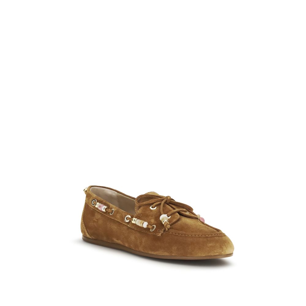 Indulge in the exquisite Stuart Weitzman Brown Calf Leather Bos Taurus Slip-On Loafers, where timeless elegance meets unparalleled craftsmanship for the discerning connoisseur.