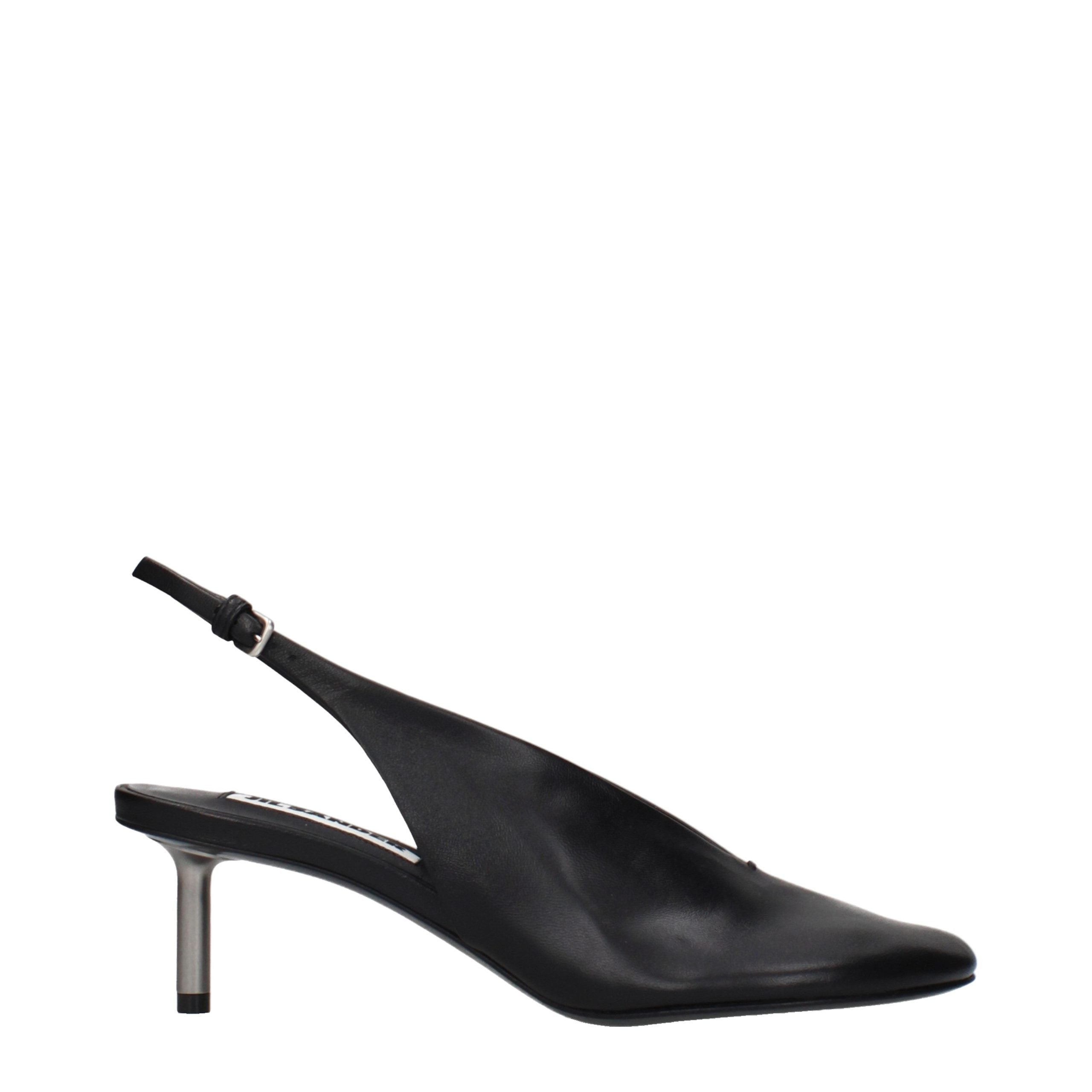 Experience the allure of Jil Sander Black Leather Pumps, where vintage elegance meets modern sophistication, perfect for the discerning connoisseur of luxury.