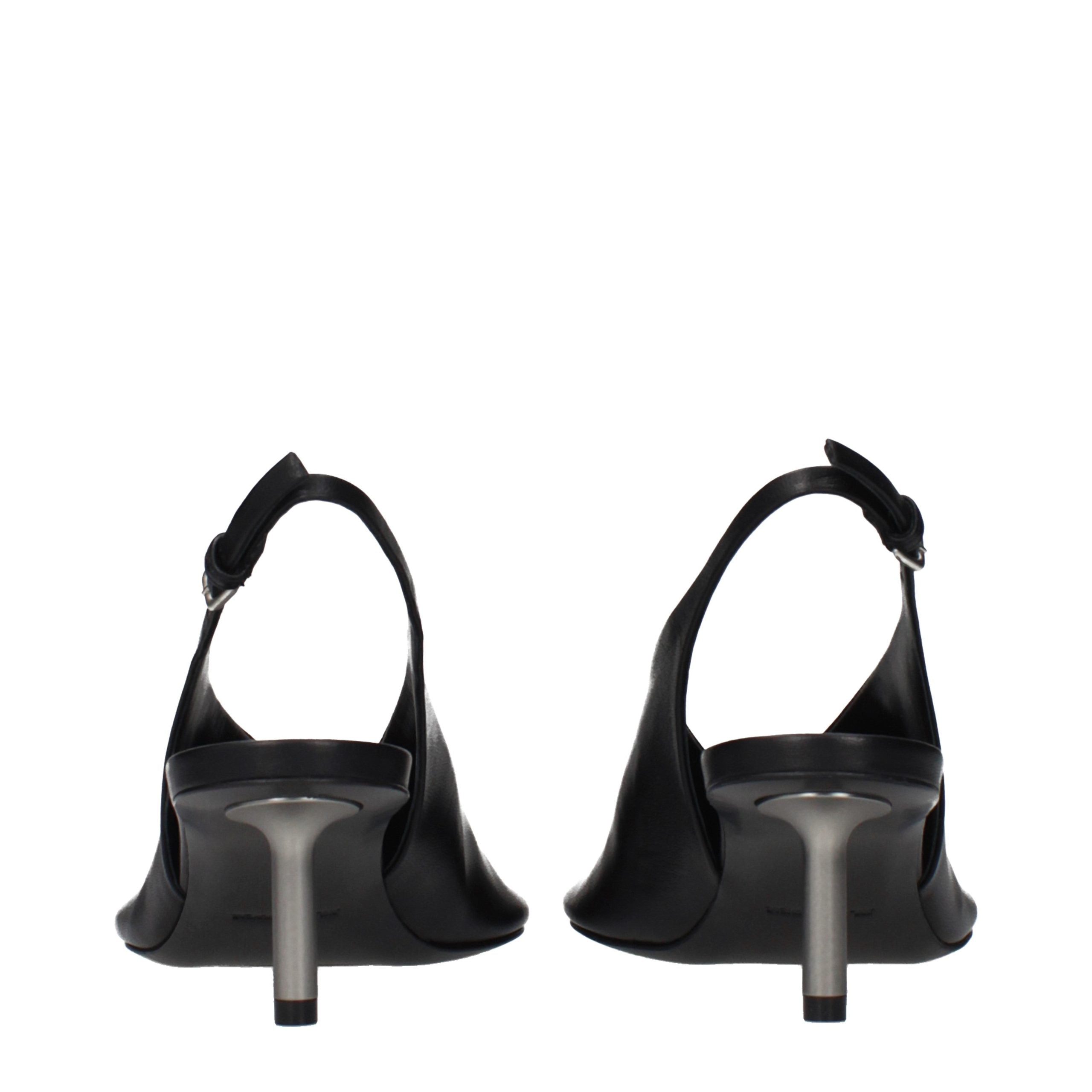 Step into timeless elegance with Jil Sander Black Leather Pumps, where exquisite craftsmanship meets vintage allure, perfect for the discerning connoisseur of luxury.