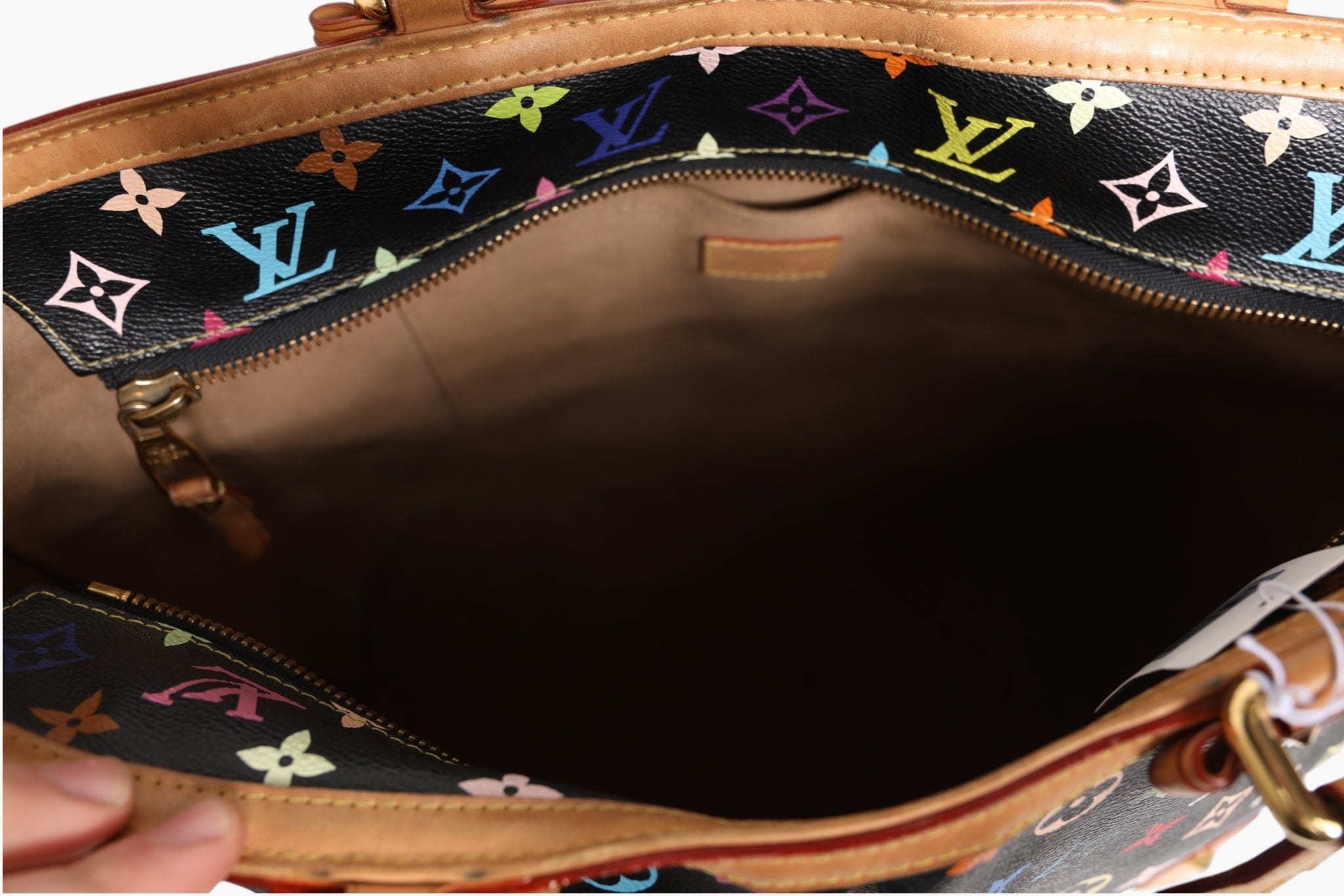 Indulge in the artistry of the Louis Vuitton Monogram Multicolor Sharleen GM, a timeless statement piece that embodies exquisite craftsmanship and luxurious sophistication.