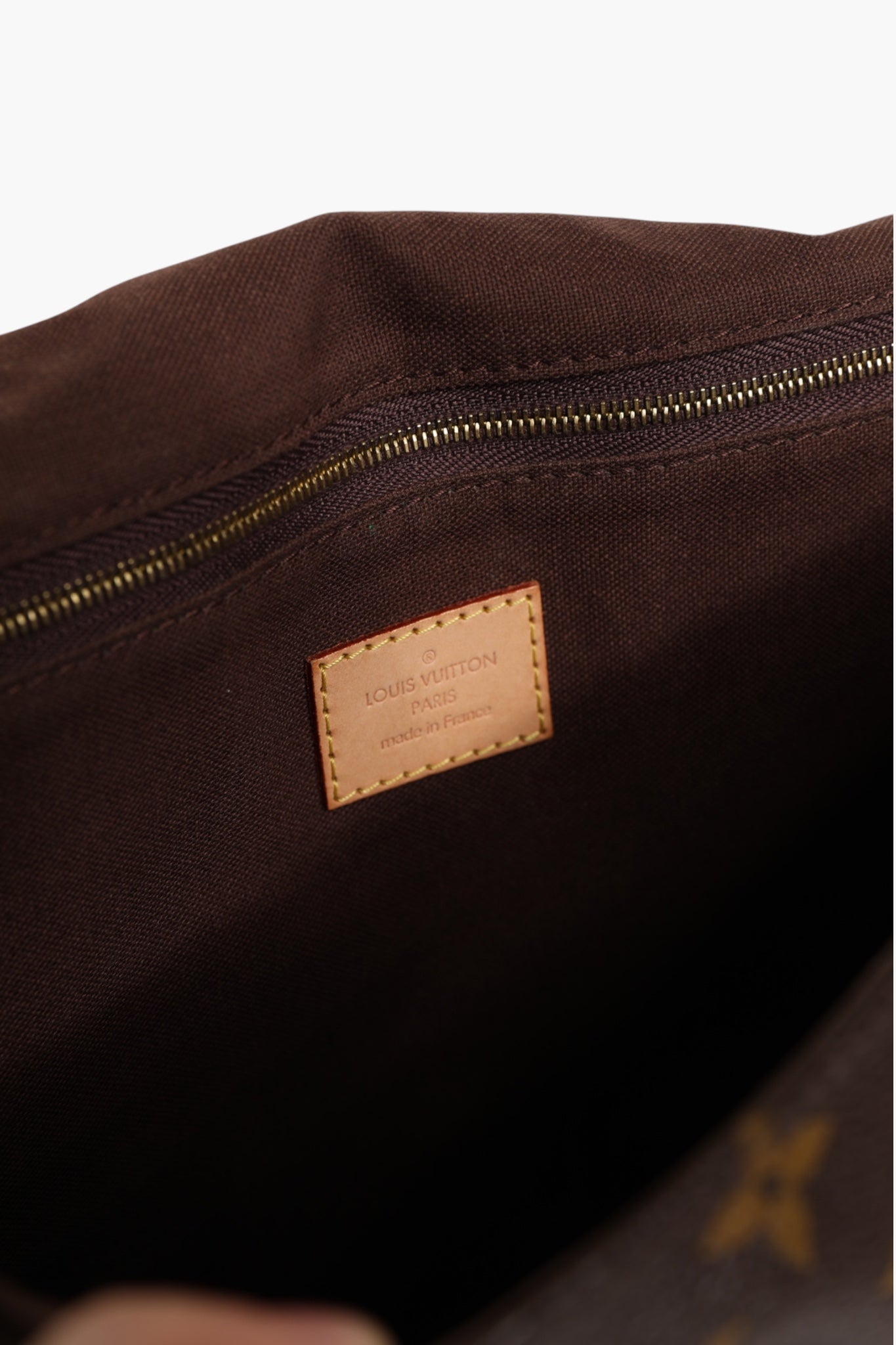 Elevate your style with the Louis Vuitton Monogram Canvas Menilmontant MM, a timeless embodiment of luxury and sophistication, perfect for the discerning connoisseur.