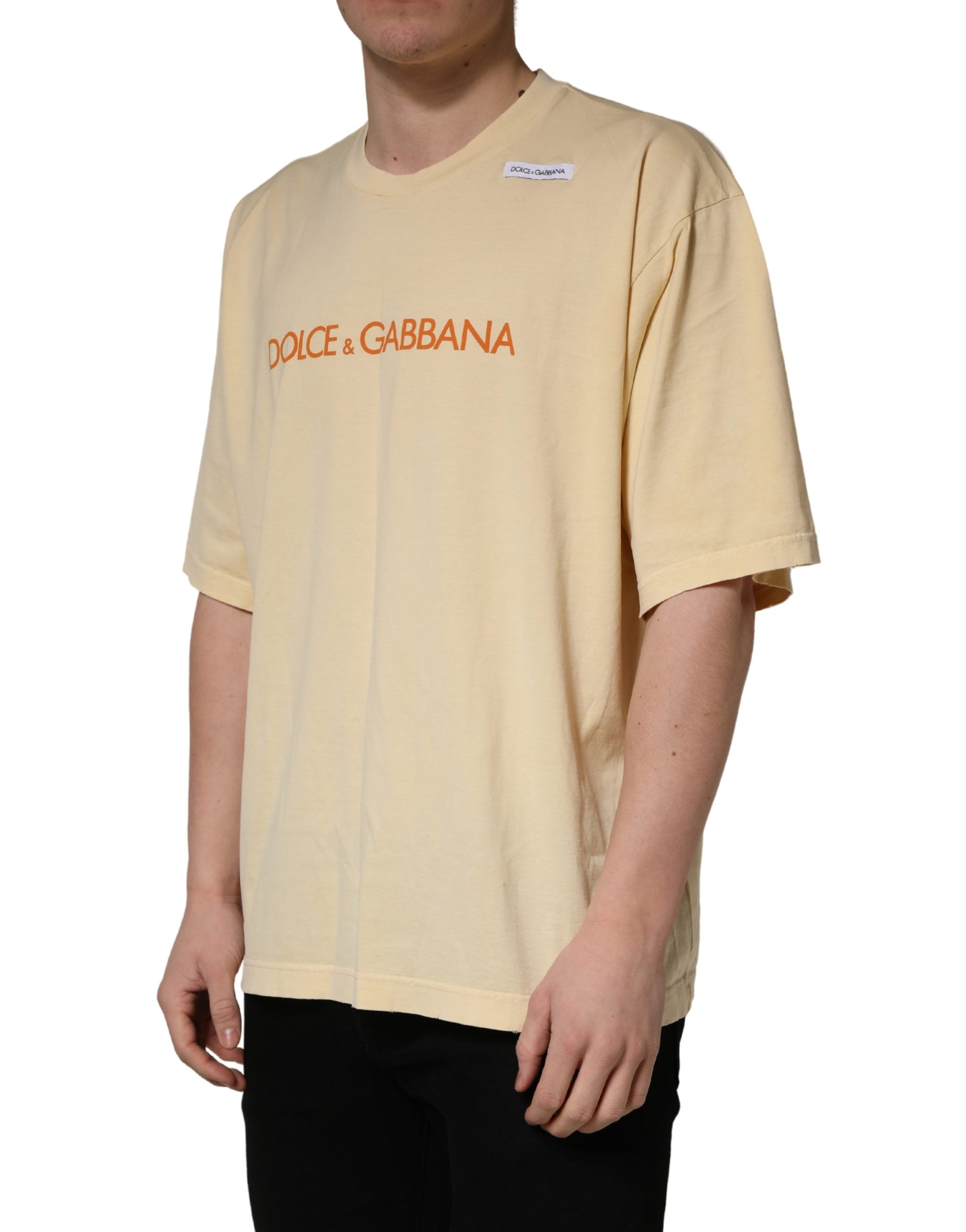Indulge in the exquisite Dolce & Gabbana Yellow Logo Print Cotton Crew Neck T-shirt, a masterpiece of Italian craftsmanship that elevates your style with effortless elegance.