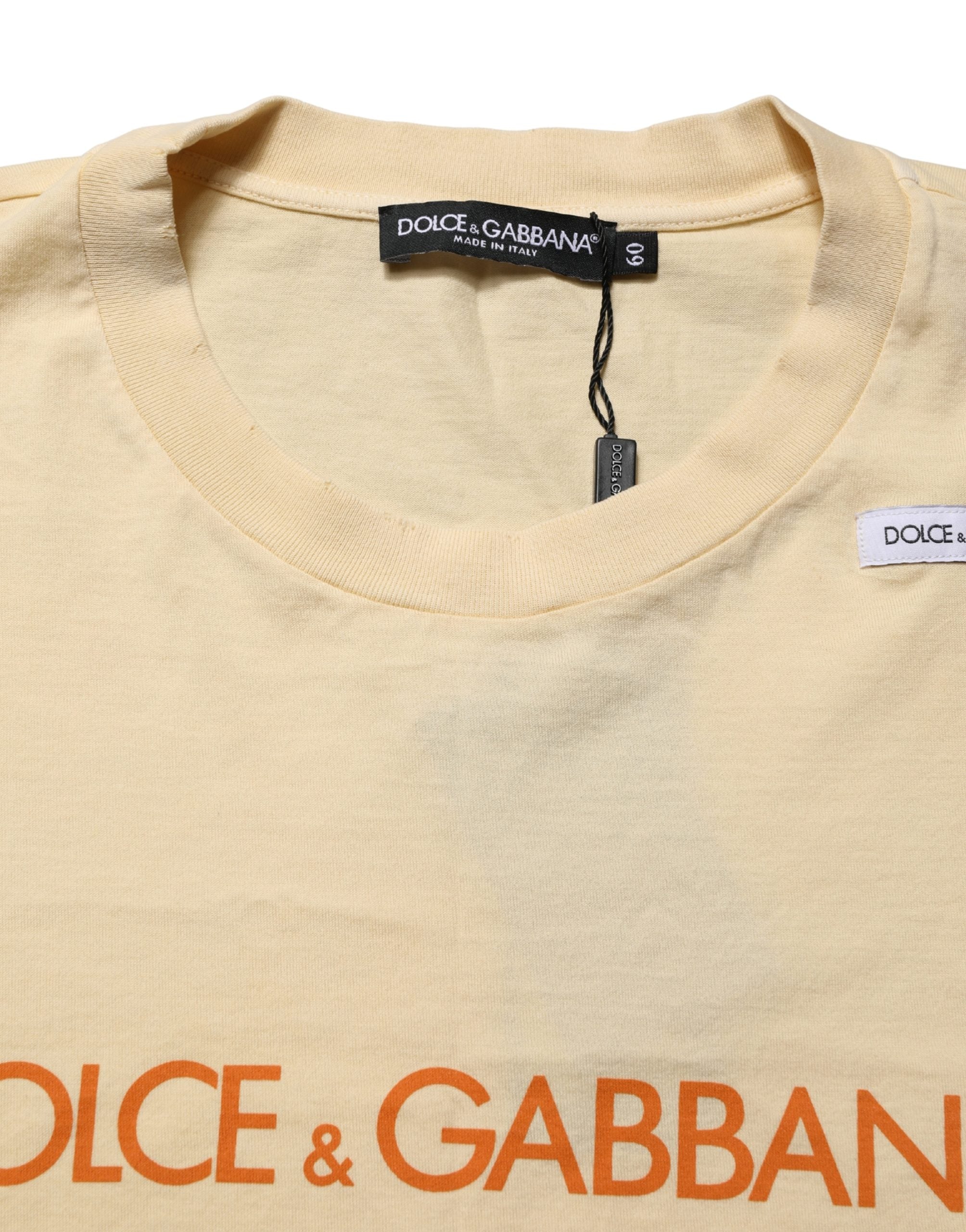 Discover the Dolce & Gabbana Yellow Logo Print Cotton Crew Neck T-shirt, a testament to Italian craftsmanship that elevates your style with vibrant elegance and unique character.