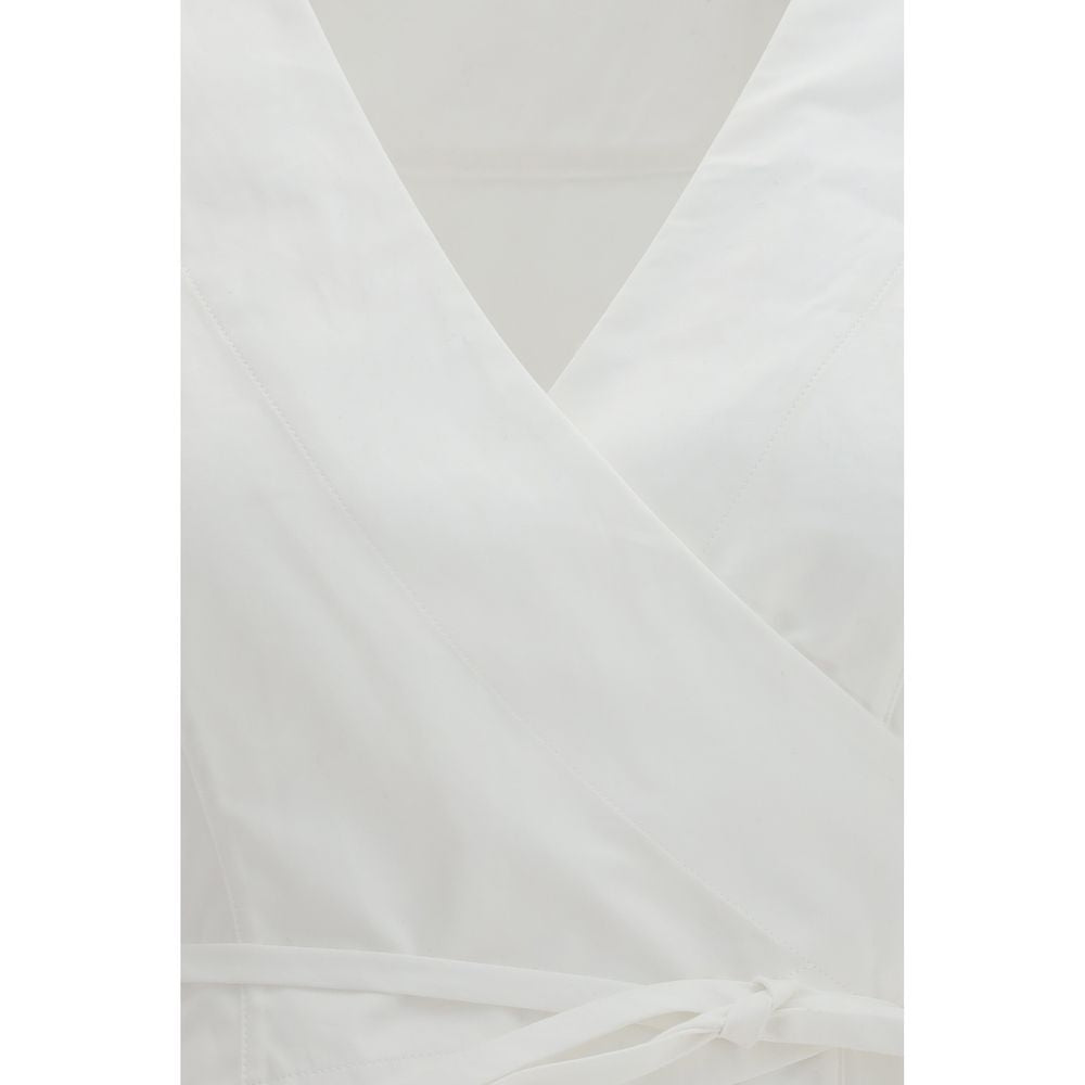 Indulge in the Jacquemus White Cotton Shirt from the SS26 collection, crafted from luxurious cotton poplin, embodying timeless elegance and sophisticated allure for every occasion.
