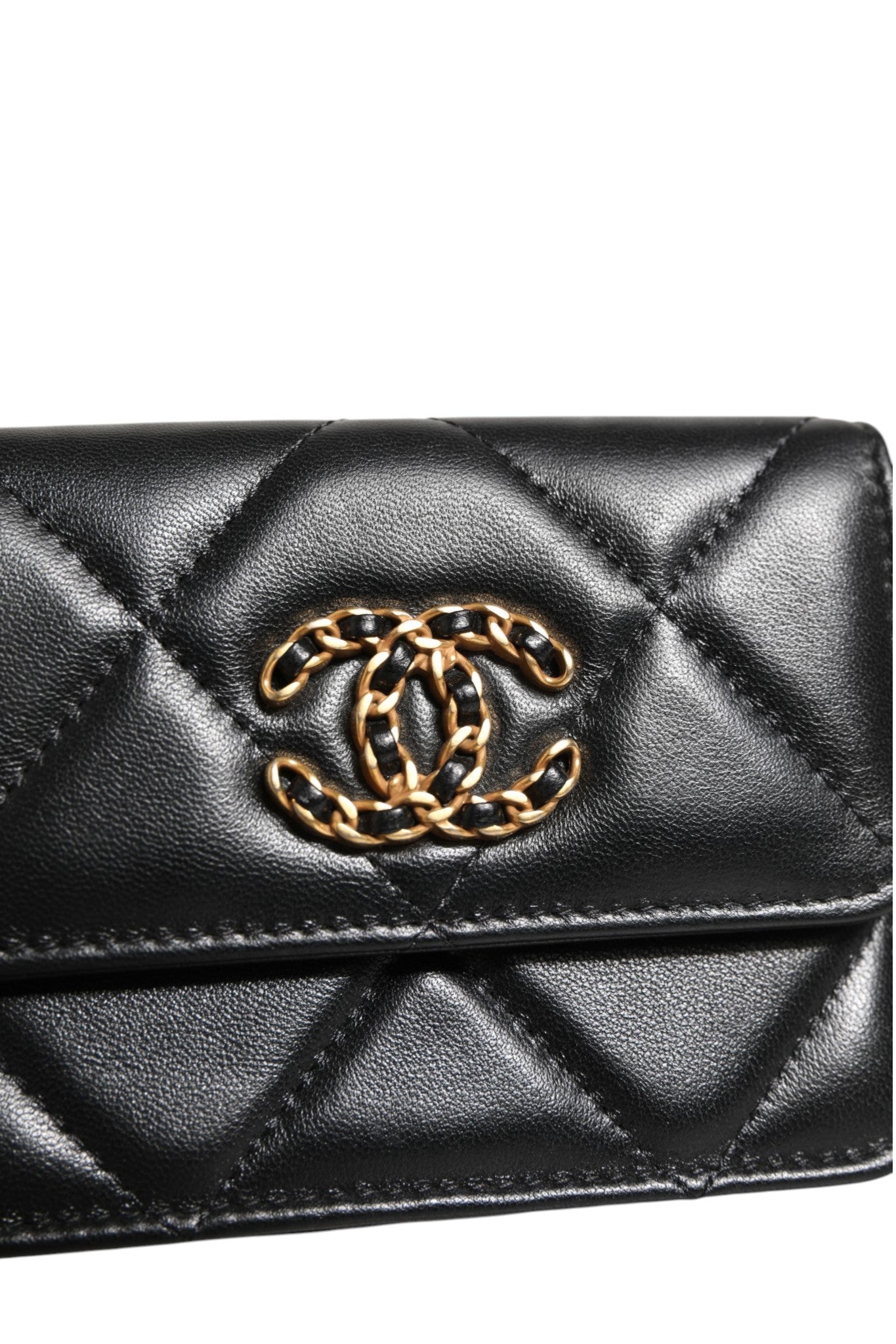 Discover the Chanel 19 Flap Coin Purse, a masterpiece in quilted leather, epitomizing timeless elegance and exquisite craftsmanship for the discerning connoisseur.