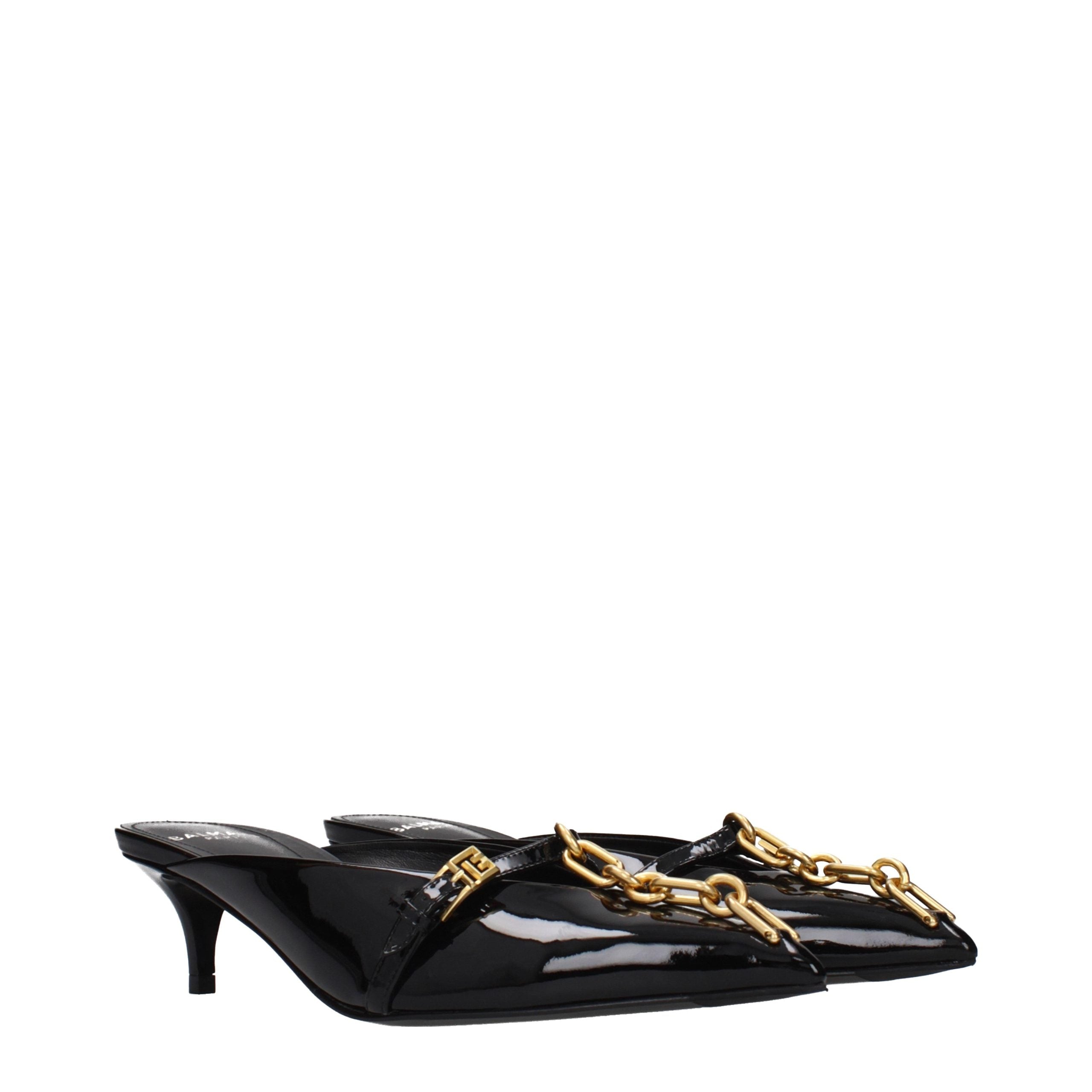 Elevate your allure with Balmain Black Leather Platform Sandals, crafted from sumptuous patent leather, embodying timeless elegance and artisanal luxury for discerning tastes.