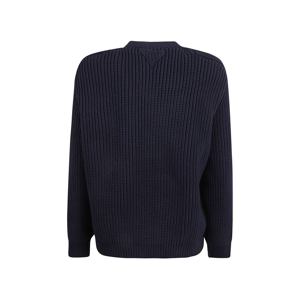 Elevate your wardrobe with the Prada Blue Cotton Cardigan, a timeless piece of exquisite craftsmanship that embodies luxury and sophistication for every occasion.