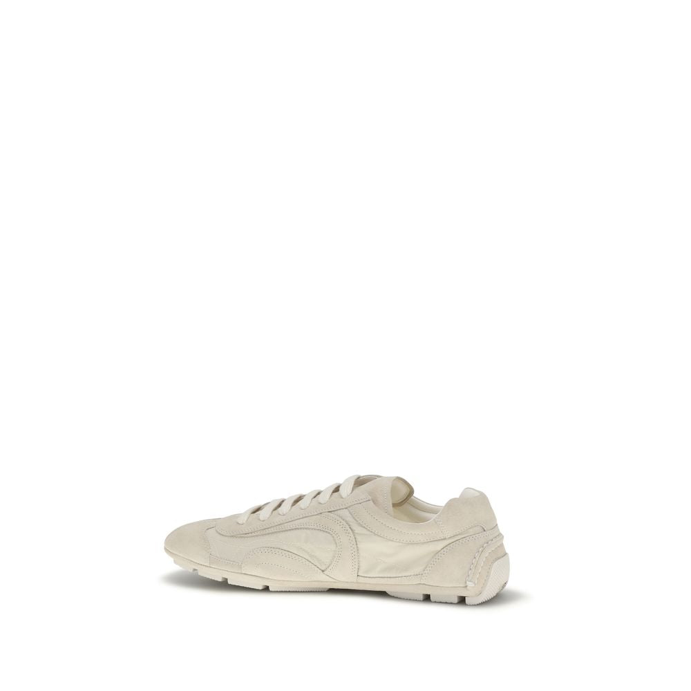 Step into unparalleled elegance with Prada Beige Calf Leather Bos Taurus Sneakers, a luxurious blend of retro design and modern sustainability for the discerning individual.