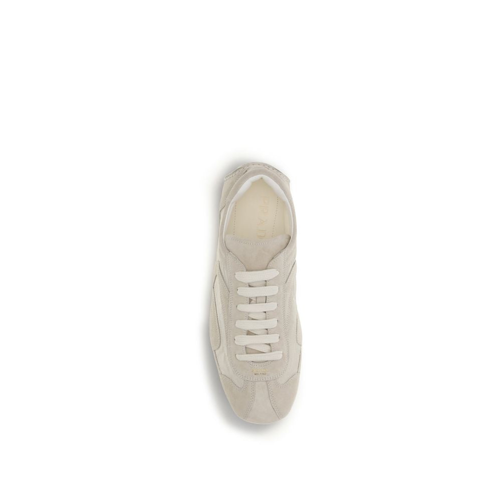 Step into refined elegance with Prada Beige Calf Leather Bos Taurus Sneakers, where luxurious craftsmanship meets retro sophistication for the discerning individual.