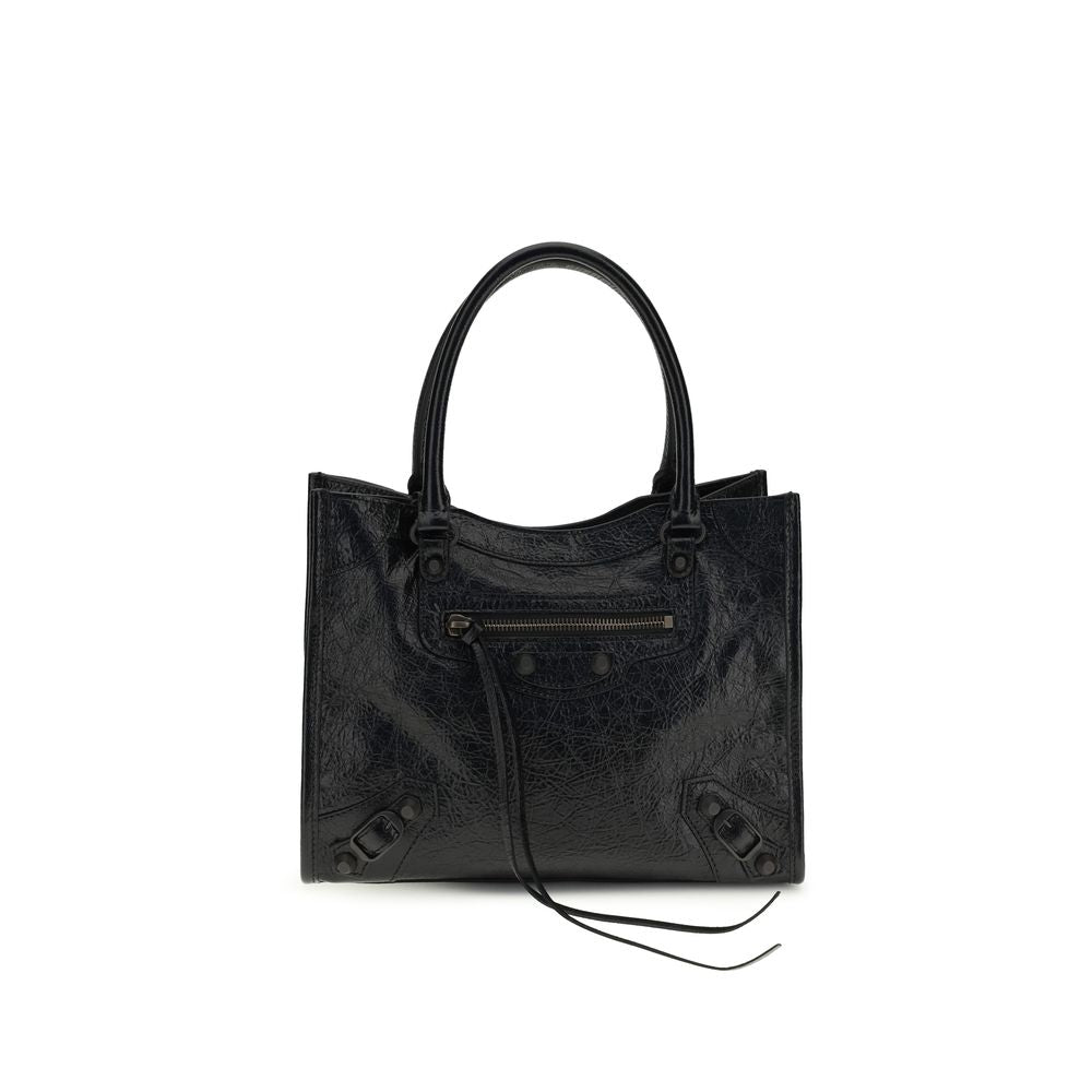 Experience the exquisite elegance of the Balenciaga Black Lamb Ovis Aries Aries Shoulder Bag, crafted from sumptuous Arena lambskin for a timeless statement of luxury.