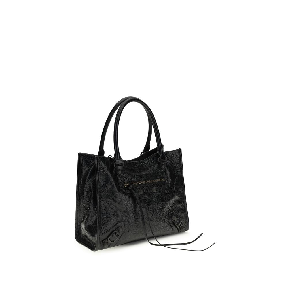 Discover the Balenciaga Black Lamb Ovis Aries Aries Shoulder Bag, a masterpiece of Arena lambskin and brass hardware, epitomizing luxury and timeless elegance for the discerning individual.
