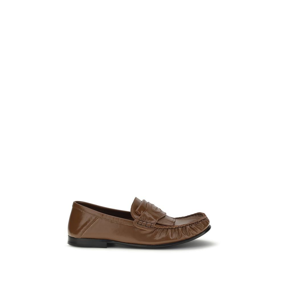 Experience the exquisite Marni Brown Lamb Ovis Aries Slip-On Loafers, crafted from luxurious lamb leather, embodying sophistication and versatility for the discerning individual.