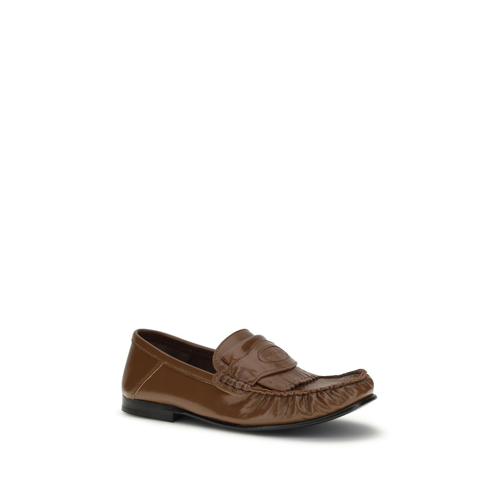 Elevate your style with Marni Brown Lamb Ovis Aries Slip-On Loafers, crafted in Italy from luxurious lamb leather, blending sophistication and versatility for every occasion.