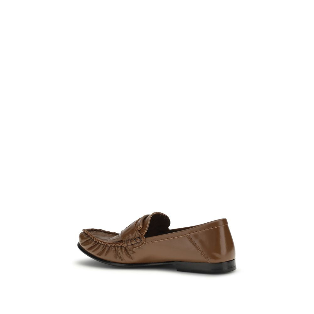Elevate your style with Marni's Brown Lamb Ovis Aries Slip-On Loafers, crafted in Italy from luxurious lamb leather, embodying sophistication and versatility for every occasion.