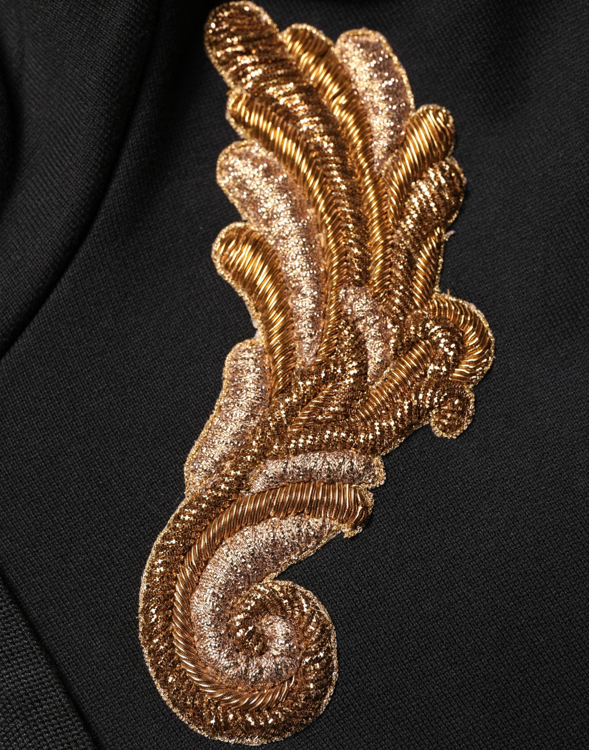 Indulge in the exquisite Dolce & Gabbana Black Embroidered Tassel Hooded Sweatshirt, where Italian craftsmanship meets luxurious materials for a sophisticated allure.
