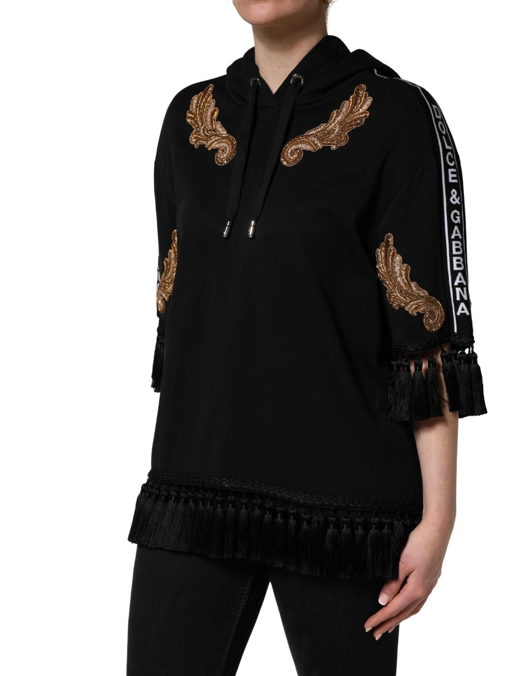 Elevate your wardrobe with the Dolce & Gabbana Black Embroidered Tassel Hooded Sweatshirt, a masterpiece of Italian craftsmanship that embodies luxury and sophistication.
