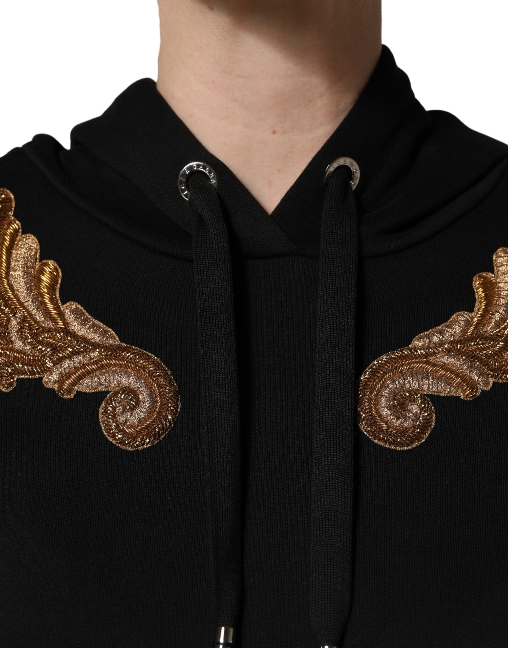 Elevate your wardrobe with the Dolce & Gabbana Black Embroidered Tassel Hooded Sweatshirt, a masterpiece of Italian craftsmanship and luxurious materials, perfect for the discerning individual.