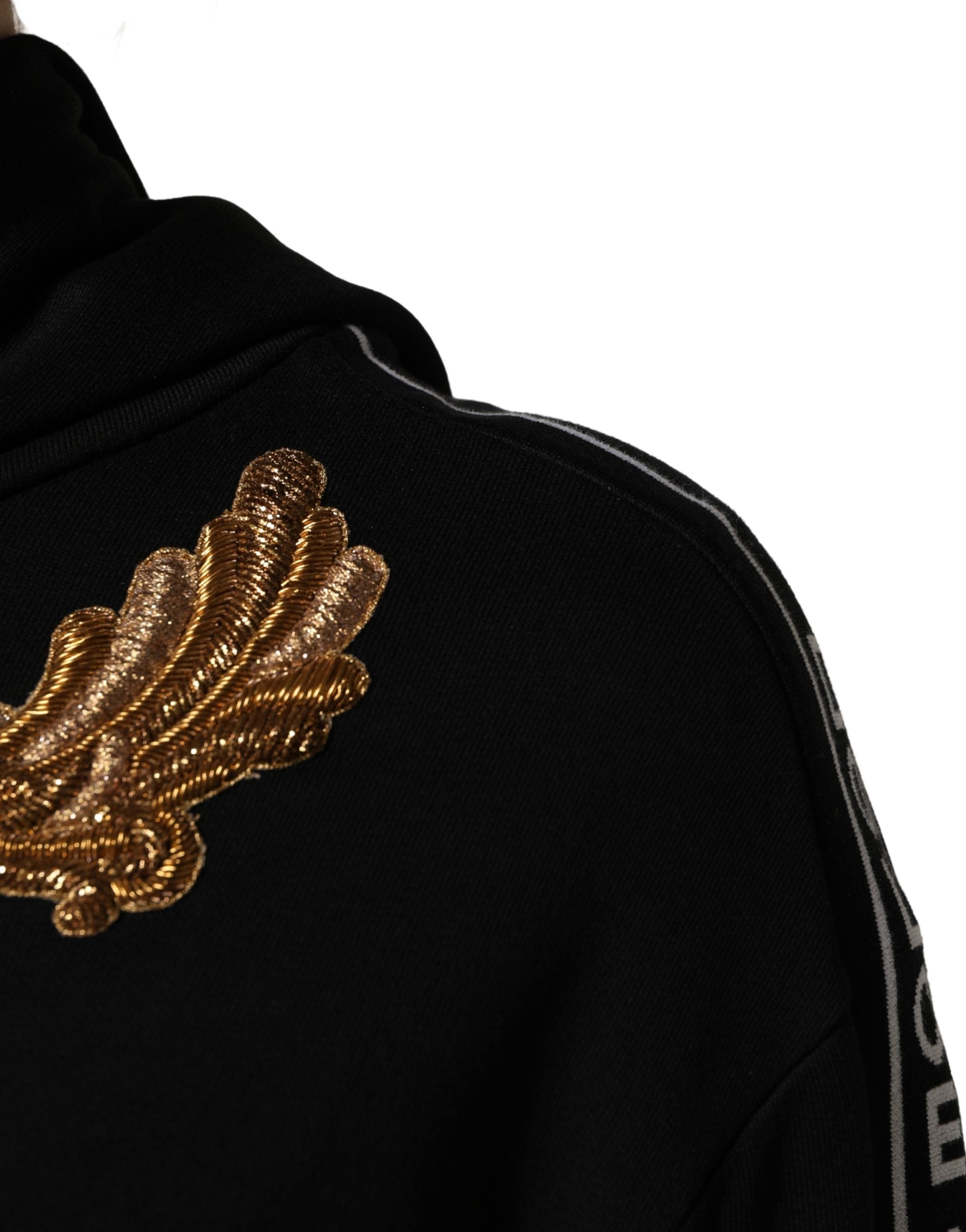 Elevate your wardrobe with the Dolce & Gabbana Black Embroidered Tassel Hooded Sweatshirt, a masterpiece of Italian craftsmanship that exudes luxury and sophistication.