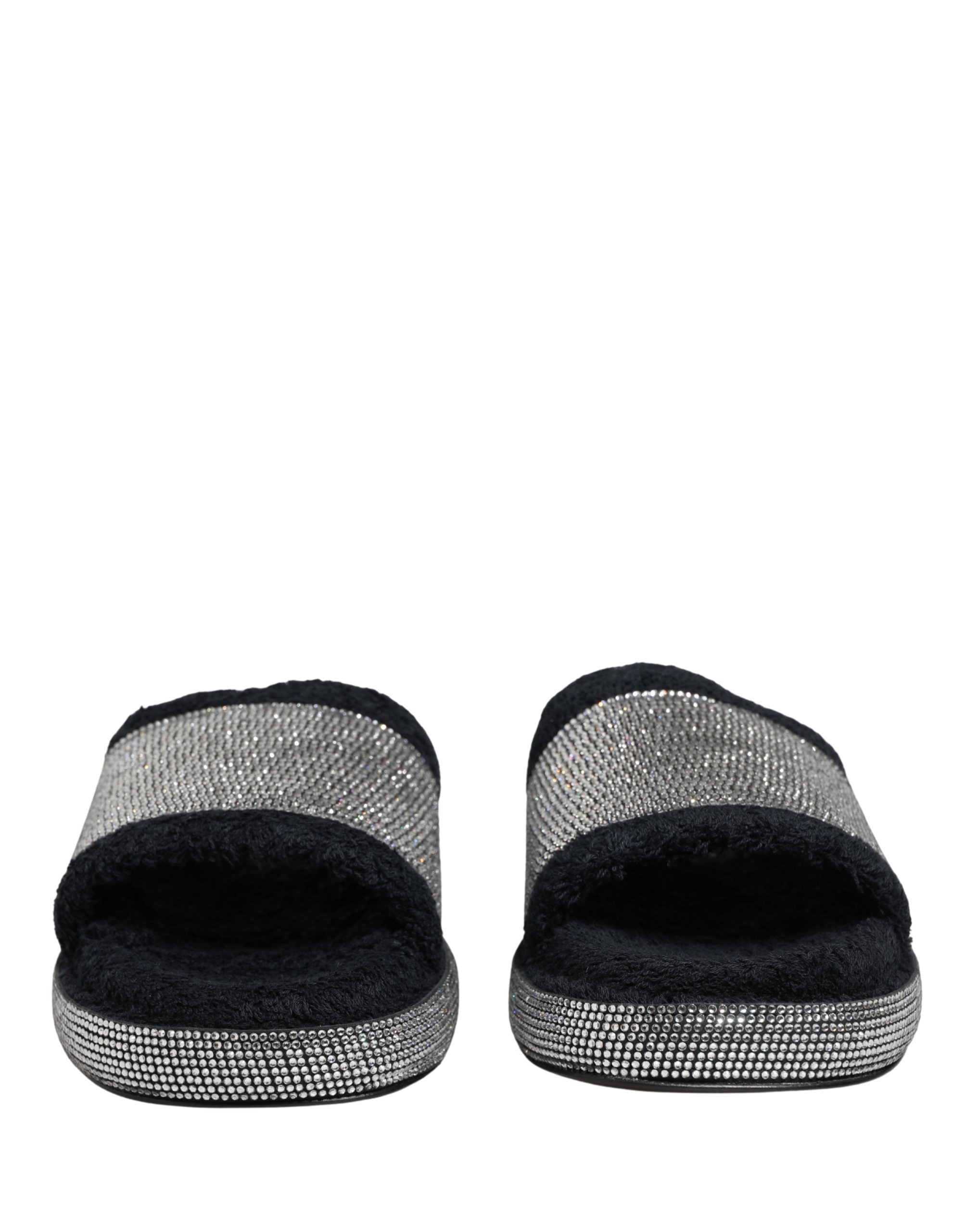 Discover the allure of Dolce & Gabbana's black crystal-embellished platform slides, where exquisite craftsmanship meets luxurious comfort, perfect for the discerning individual.