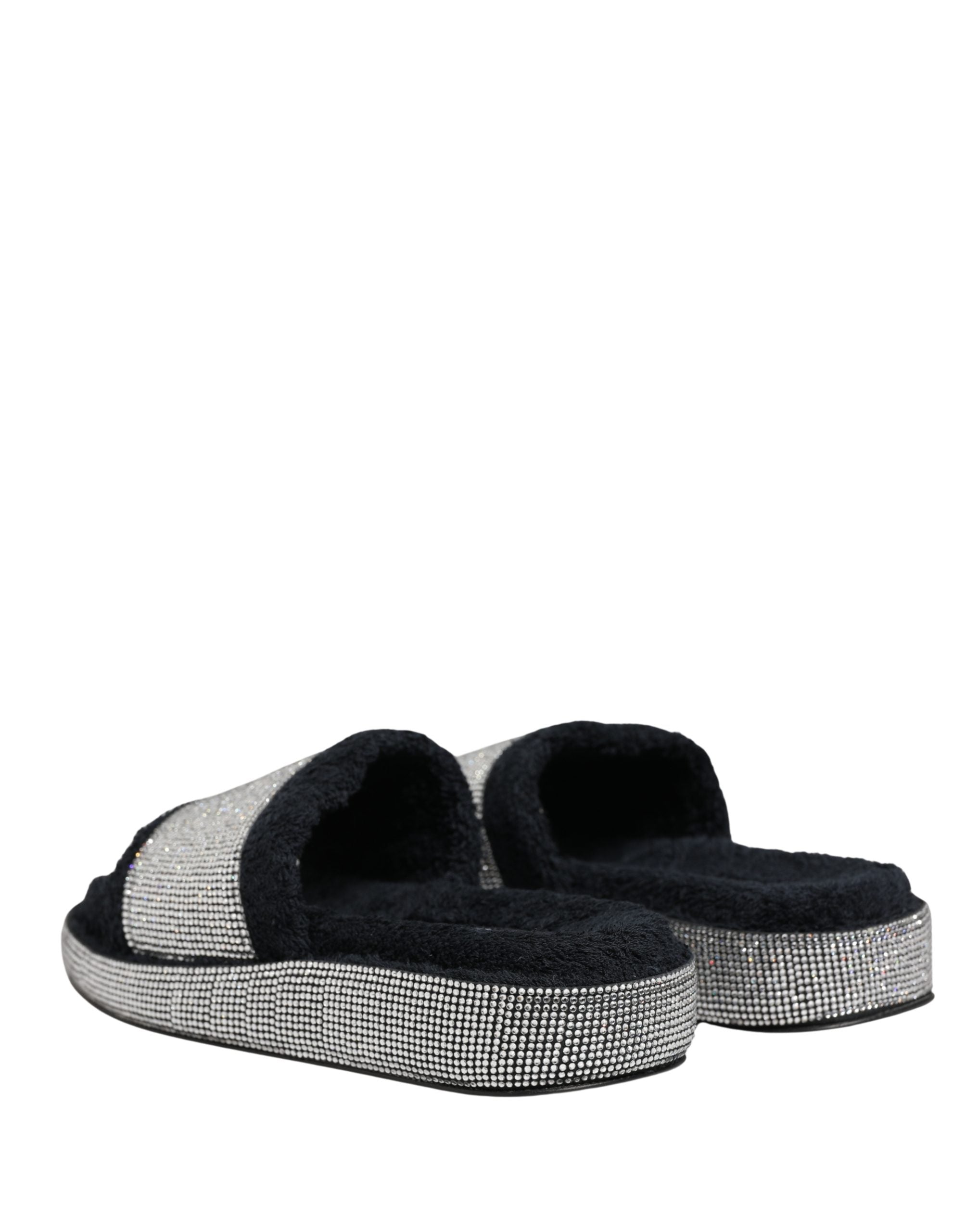 Step into a realm of elegance with Dolce & Gabbana's black crystal-embellished platform slides, where exquisite craftsmanship meets luxurious comfort, perfect for the discerning individual.