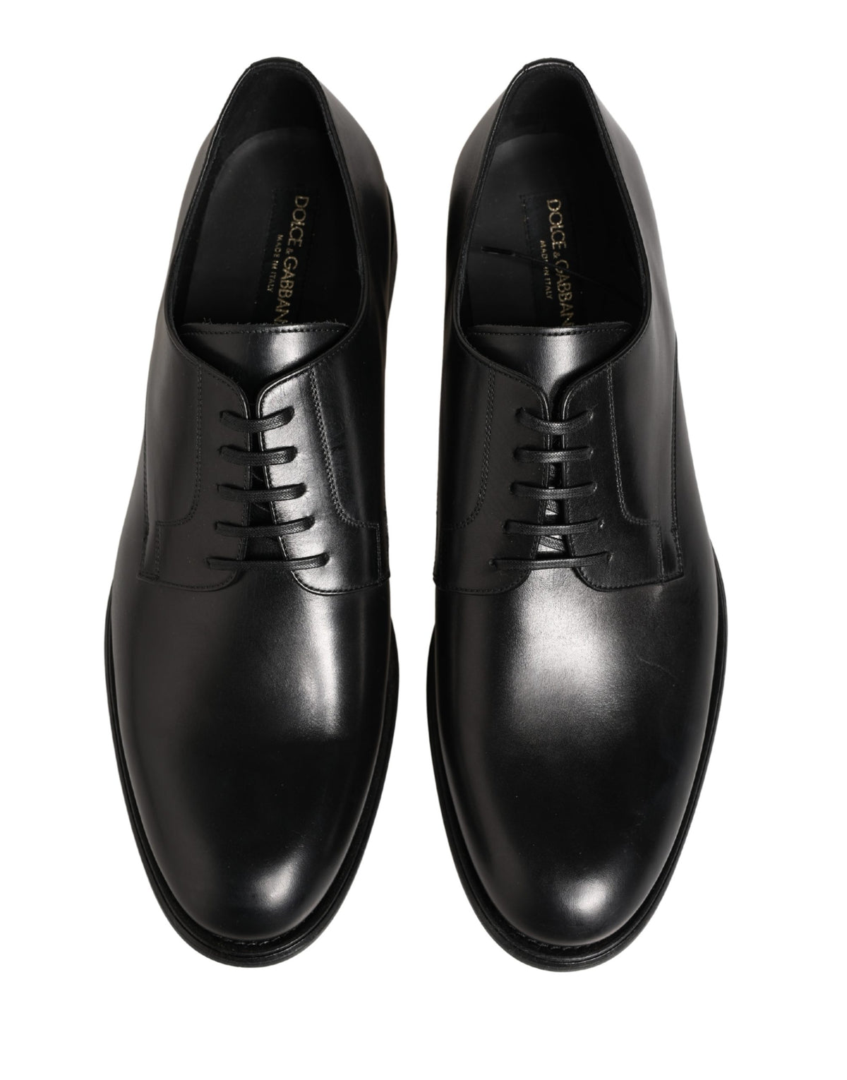Discover the exquisite Dolce & Gabbana Black Calfskin Leather Derby Shoes, a fusion of timeless elegance and modern sophistication, crafted for the discerning individual.