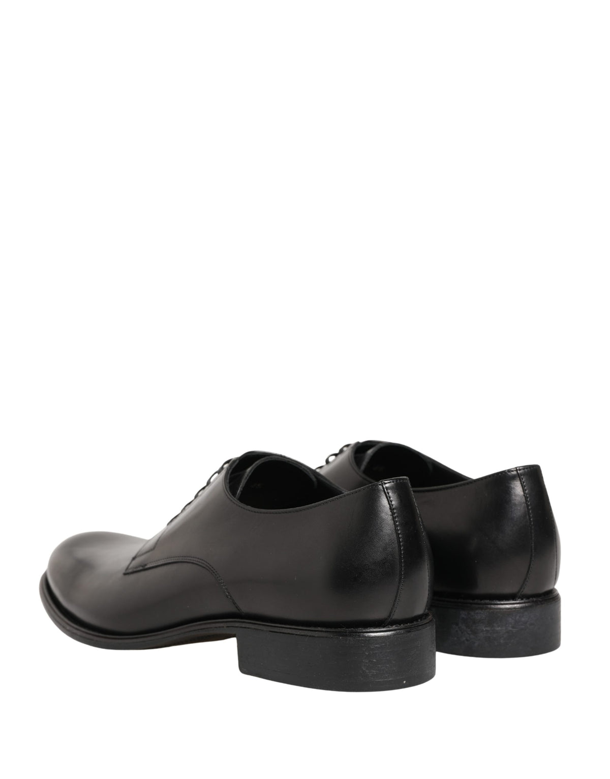 Indulge in the exquisite allure of Dolce & Gabbana's Black Calfskin Leather Derby Shoes, where timeless craftsmanship meets modern sophistication for a statement of luxury.