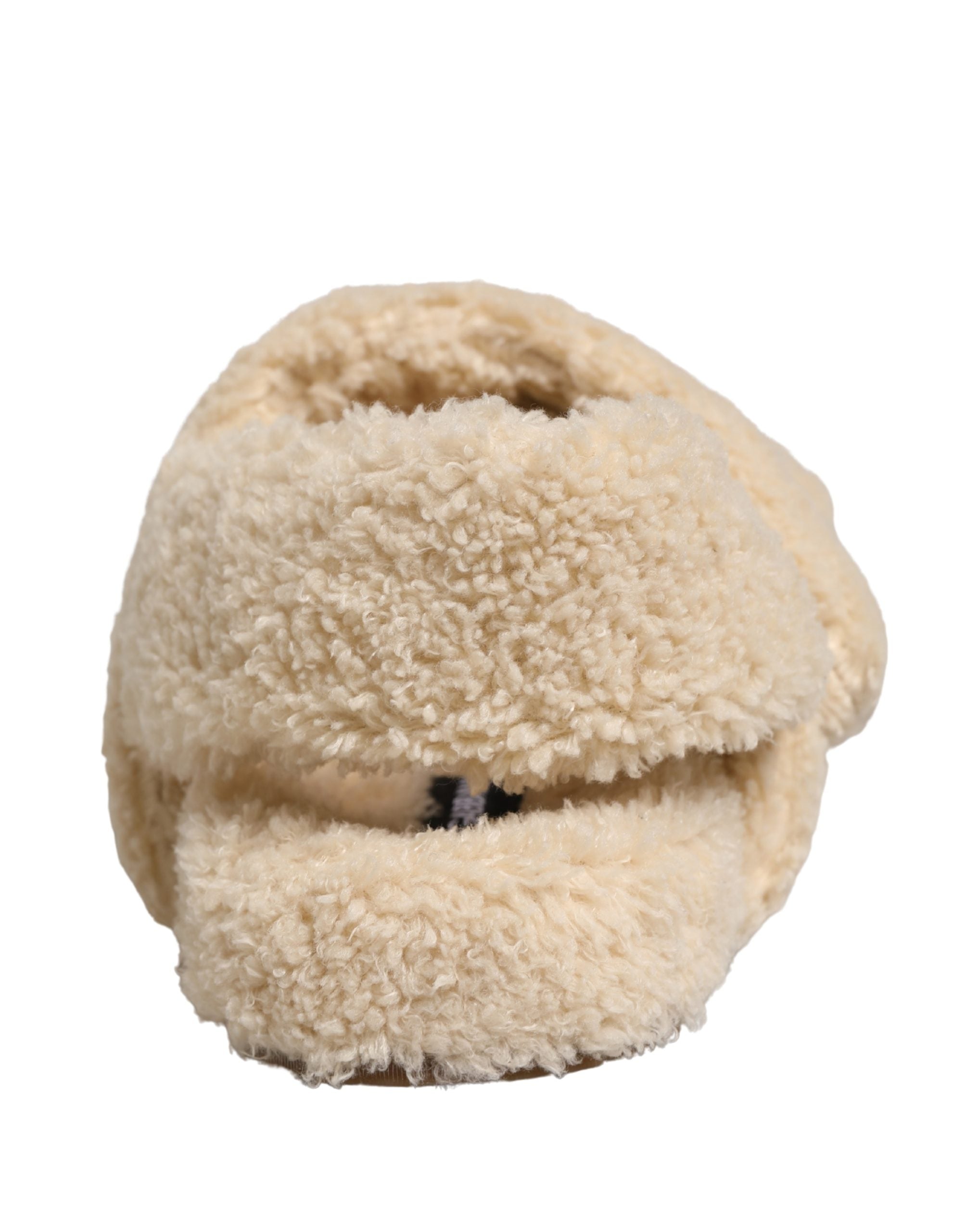 Elevate your style with Dolce & Gabbana's Beige Faux Fur Slides, where sumptuous comfort meets high-fashion elegance, perfect for the discerning individual.