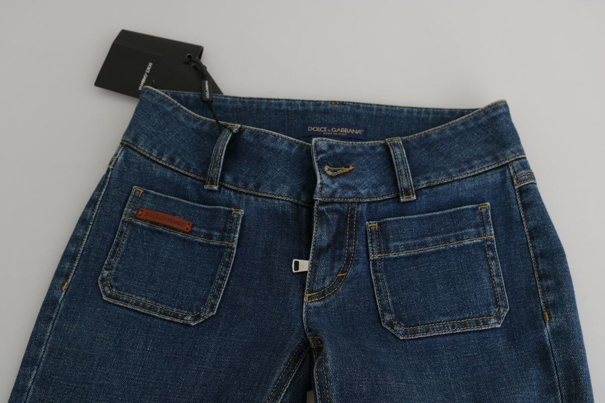 Indulge in the exquisite allure of Dolce & Gabbana's Blue Slim Fit Cropped Mid Waist Denim Jeans, crafted from premium materials for the discerning individual who appreciates timeless elegance.