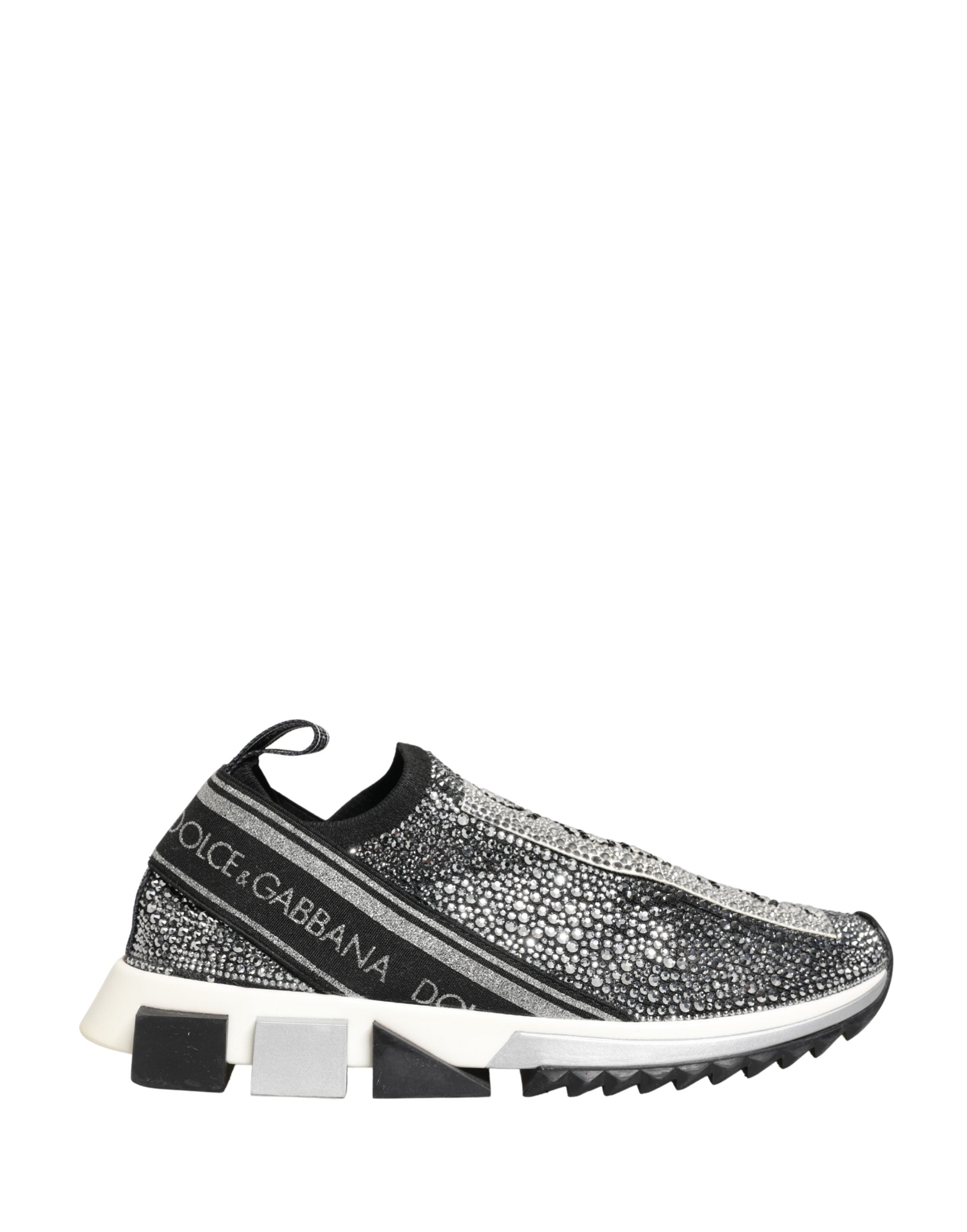 Elevate your style with Dolce & Gabbana's Silver Crystal Logo Slip On Sorrento Sneakers, where Italian craftsmanship meets luxurious comfort in a striking black and silver design.