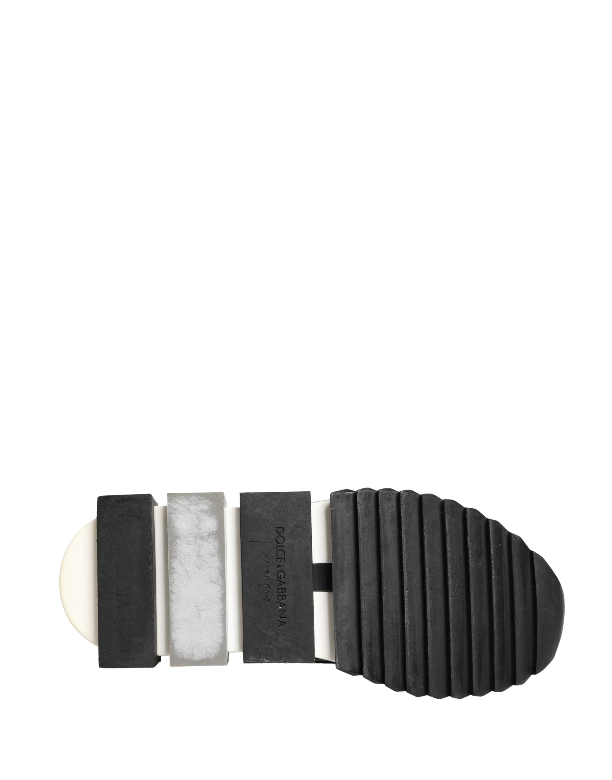 Elevate your style with Dolce & Gabbana's Silver Crystal Logo Slip On Sorrento Sneakers, where Italian craftsmanship meets luxurious materials for a statement of sophistication.