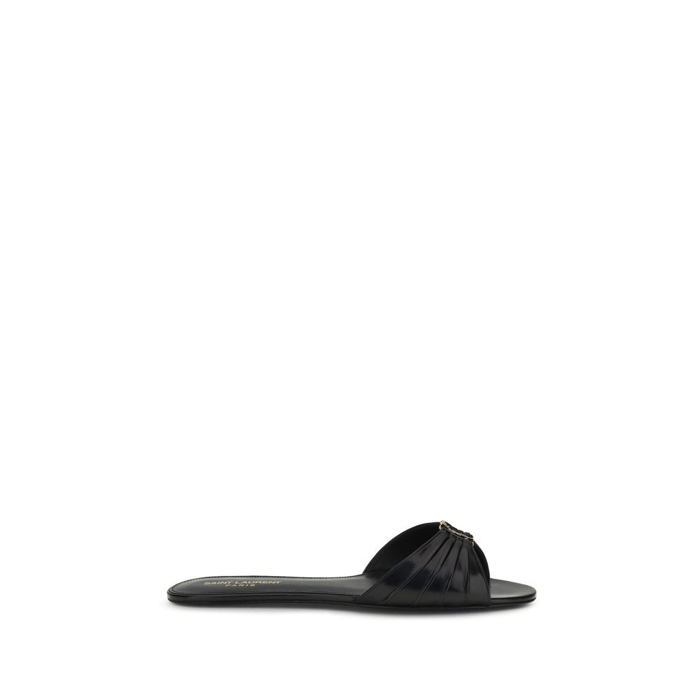 Indulge in the elegance of Saint Laurent Black Calf Leather Bos Taurus Flat Sandals, crafted for the discerning individual who values luxury and sophistication in every step.