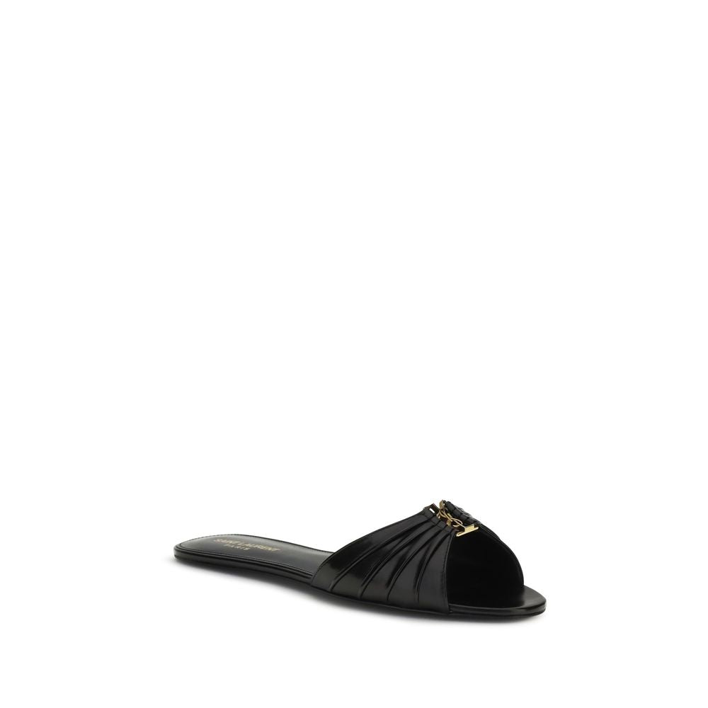 Indulge in the elegance of Saint Laurent Black Calf Leather Bos Taurus Flat Sandals, where luxurious craftsmanship meets sophisticated design for the modern connoisseur.