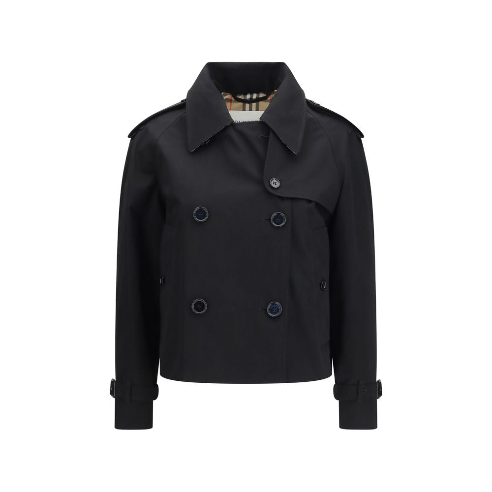 Elevate your style with the Burberry Black Cotton Trench Coat, a masterpiece of rain-resistant gabardine, merging timeless elegance with modern sophistication.