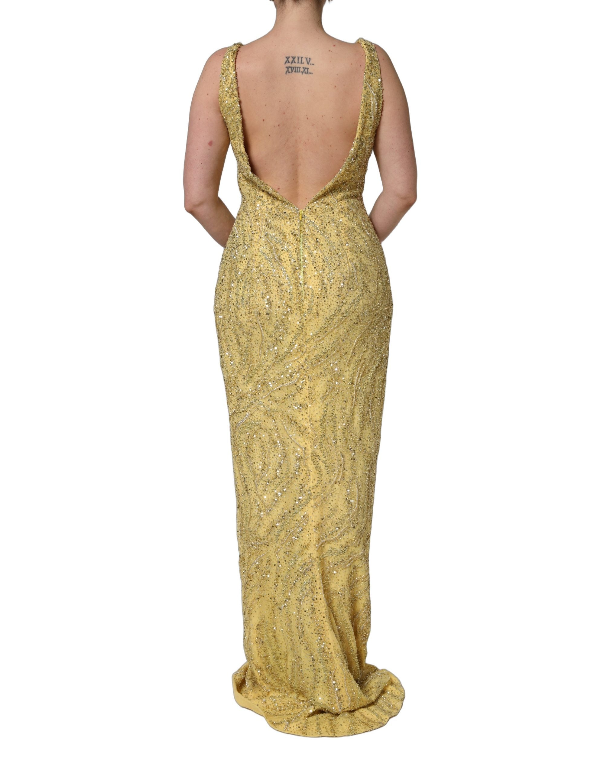 Indulge in the opulence of the Dolce & Gabbana Gold V-neckline Mermaid Sequinned Gown, a masterpiece of silk and glass that embodies luxury and elegance for unforgettable moments.