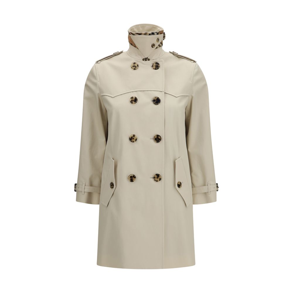 Experience the allure of the Burberry Beige Cotton Trench Coat, crafted from rain-resistant gabardine, embodying timeless elegance and sophisticated luxury for every occasion.