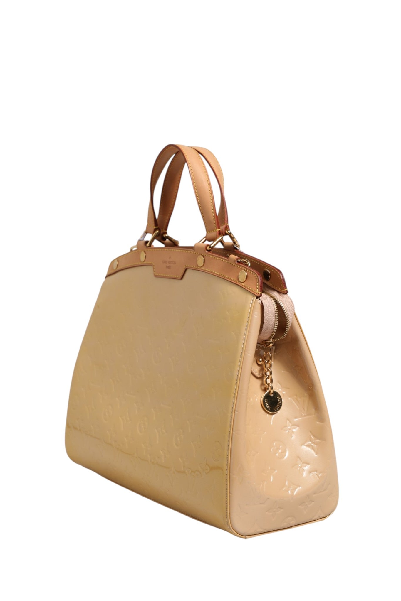 Discover the Louis Vuitton Monogram Vernis Brea MM in Beige Poudre, a timeless masterpiece that embodies exquisite craftsmanship and luxurious elegance for every occasion.