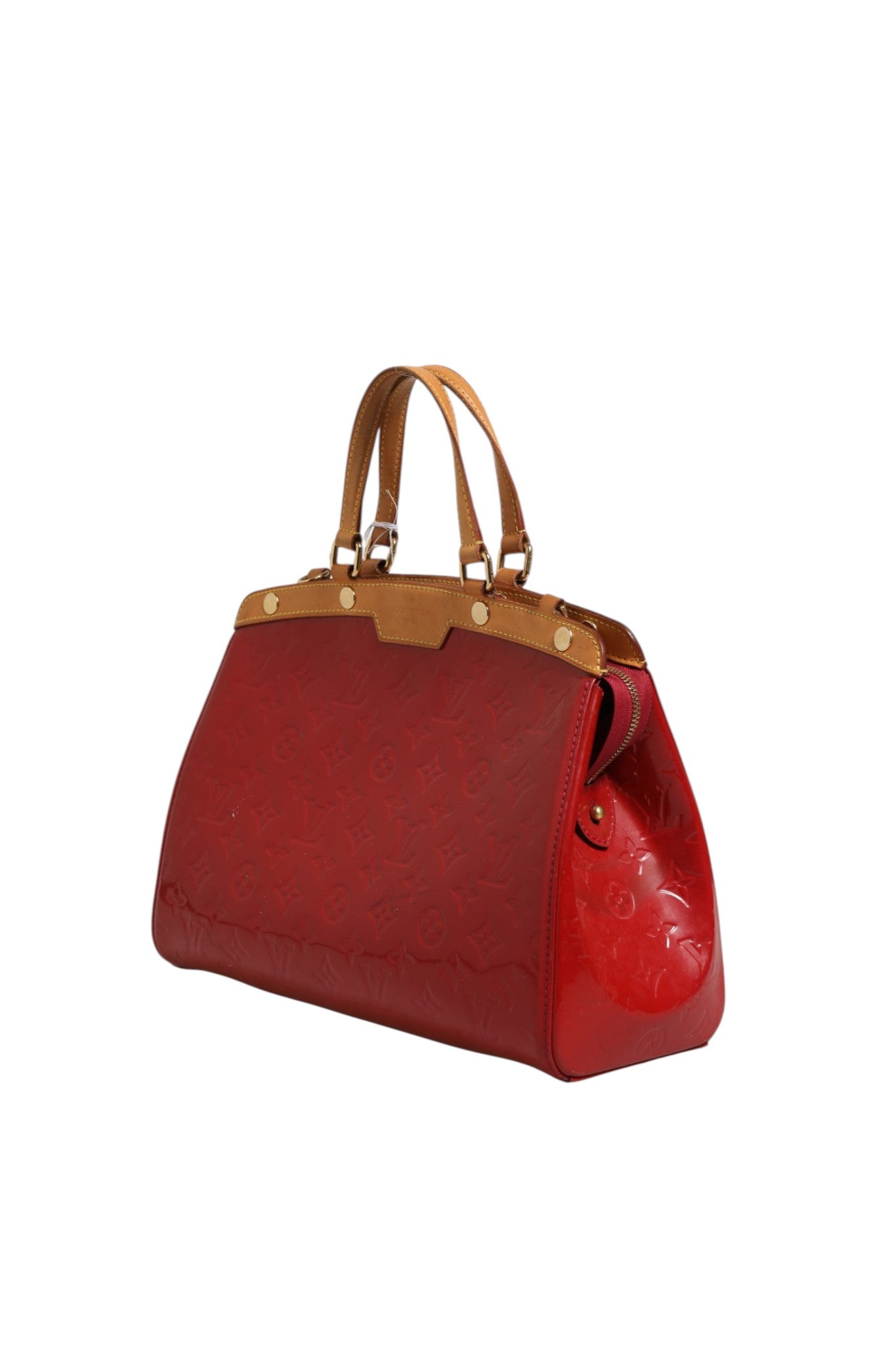 Discover the Louis Vuitton Brea MM Monogram Vernis, a striking red handbag that embodies luxury and sophistication, perfect for those who appreciate timeless elegance.