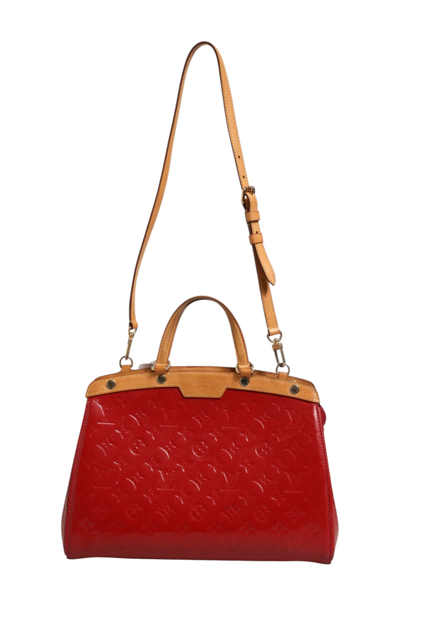 Indulge in the exquisite Louis Vuitton Brea MM Monogram Vernis, a striking red handbag that redefines luxury with its elegant design and timeless allure.