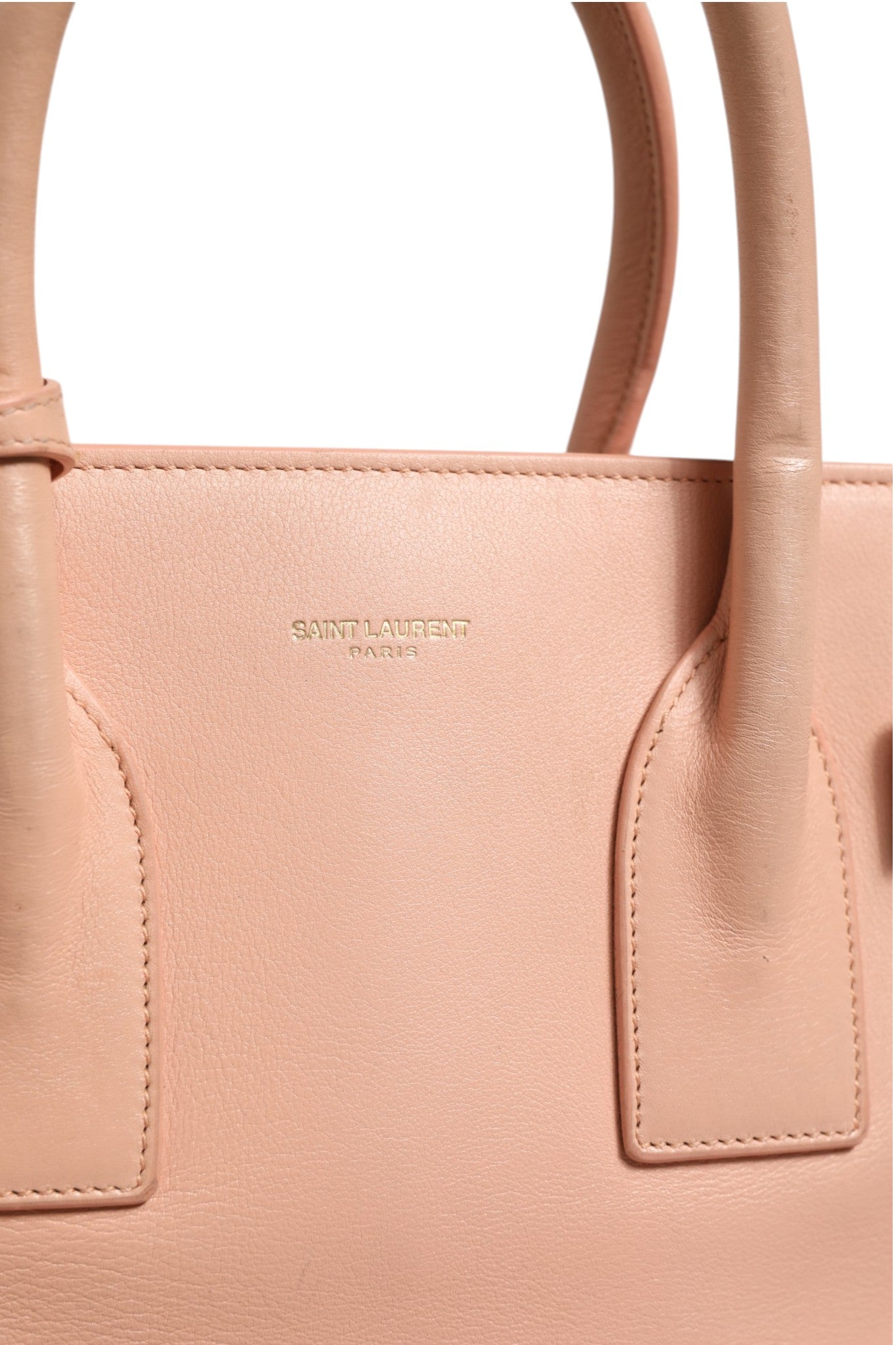 Discover the Saint Laurent Nano Sac De Jour, a luxurious pink handbag that embodies elegance and sophistication, perfect for the discerning individual who appreciates timeless style.
